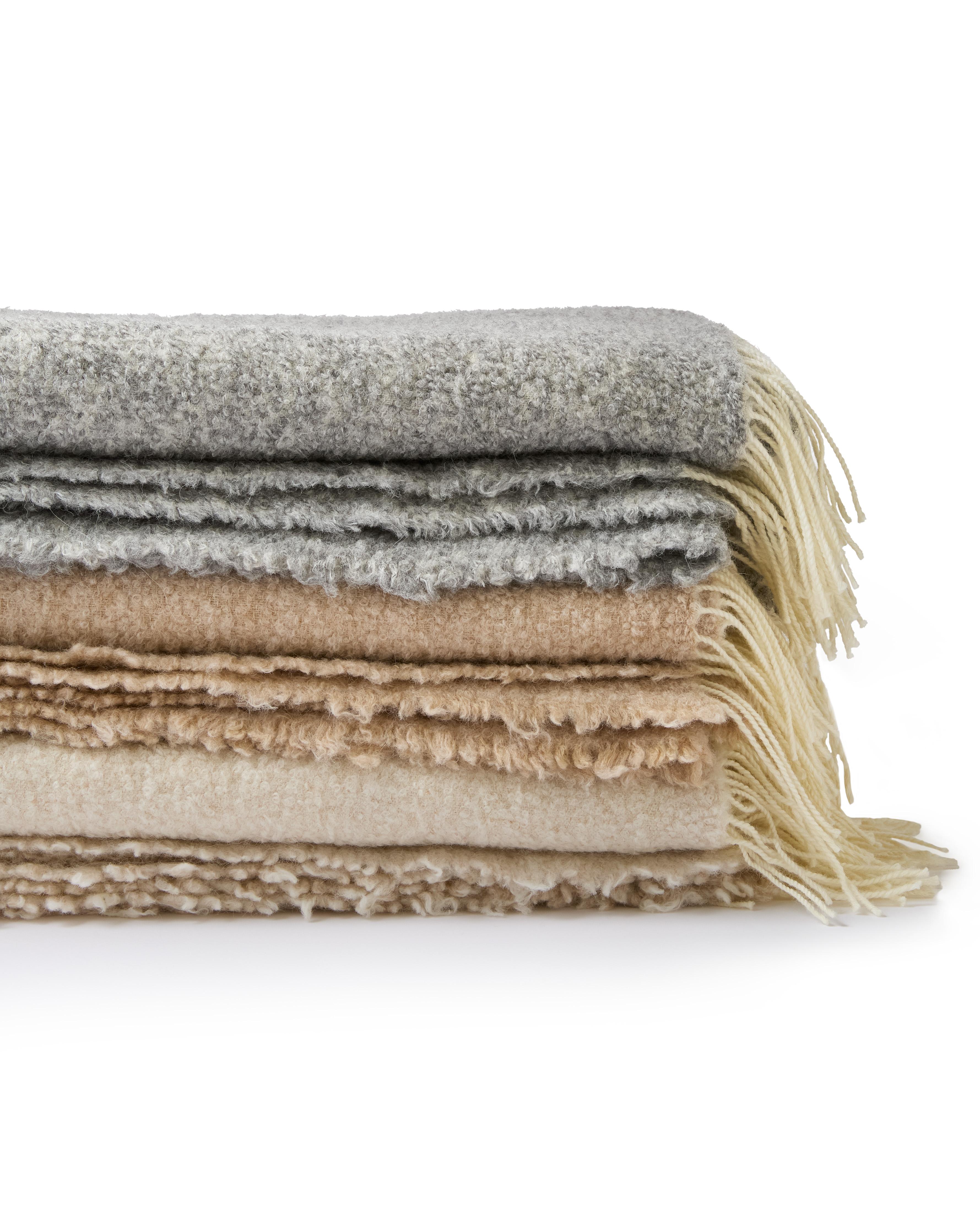 Principal’s Daughter alpaca throws are softer than cashmere and engineered to last, because we start with exceptional fibers and finish with true Italian craftsmanship. Each throw is woven from an elevated blend of 44% responsible alpaca bouclé and