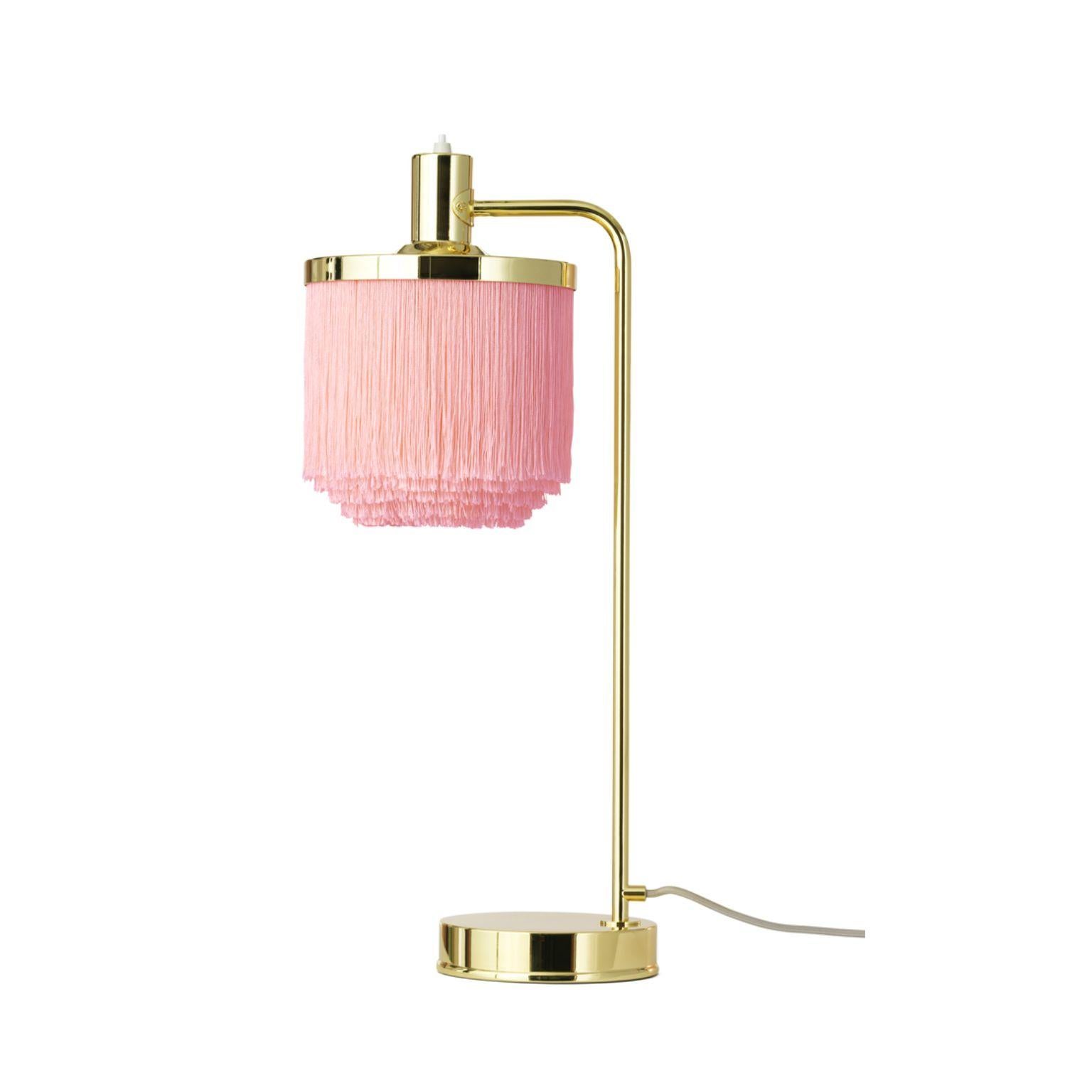 Fringe pale pink table lamp by Warm Nordic
Dimensions: D 20 x W 26 x H 61 cm
Material: Brass plated steel, Viscose fringes
Weight: 1 kg
Also available in different colours.

An iconic table lamp with sophisticated fringes, created in 1960 by the