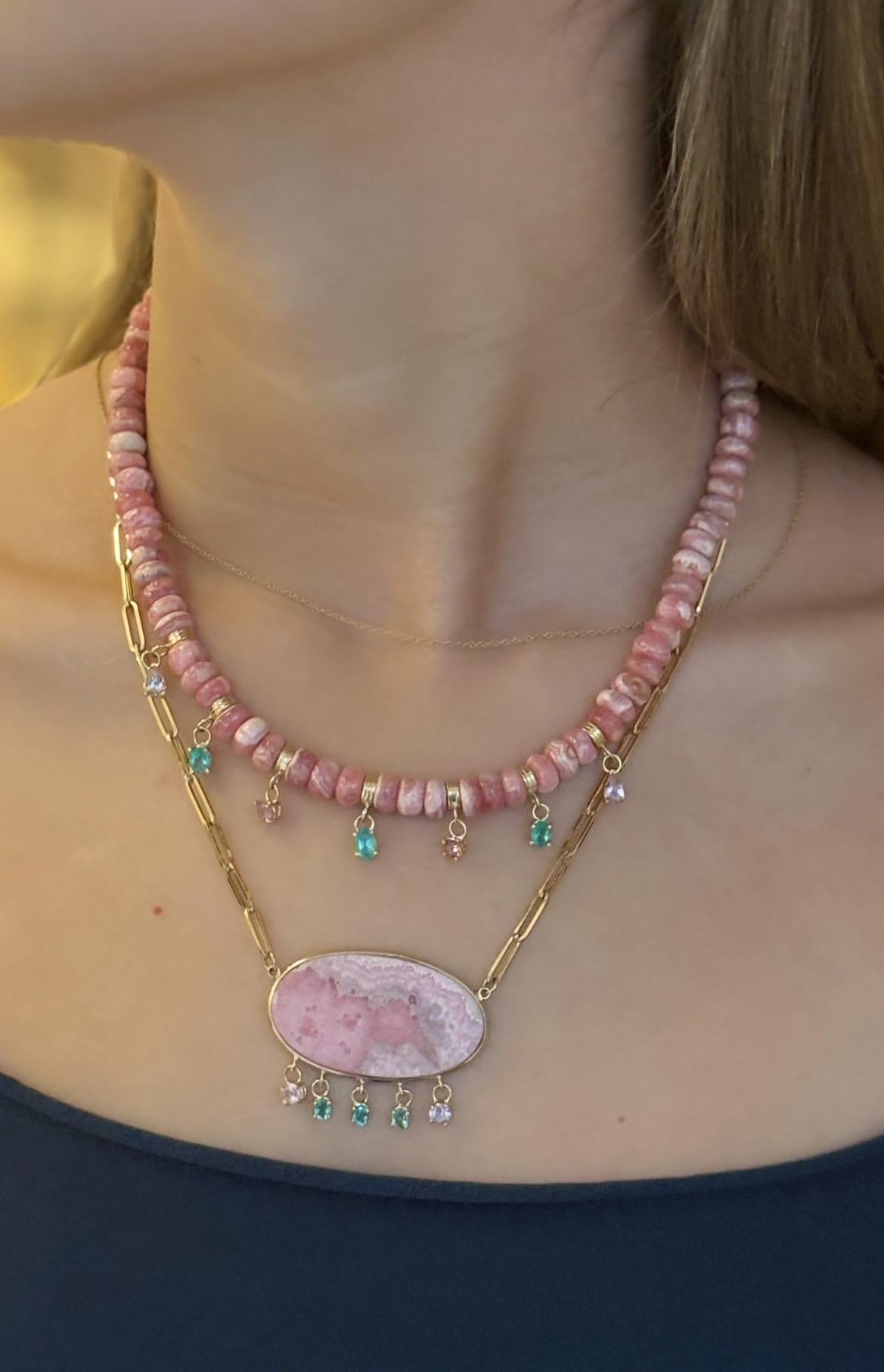 Rhodochrosite Fringe Necklace

Rhodochrosite, Emeralds, Pink Spinel 
14k Gold

Rhodochrosite rondelle beads, 10mm, with a gorgeous  pink and green fringe of gems: three emerald ovals, two round pink spinels and two pear shape pink spinels 