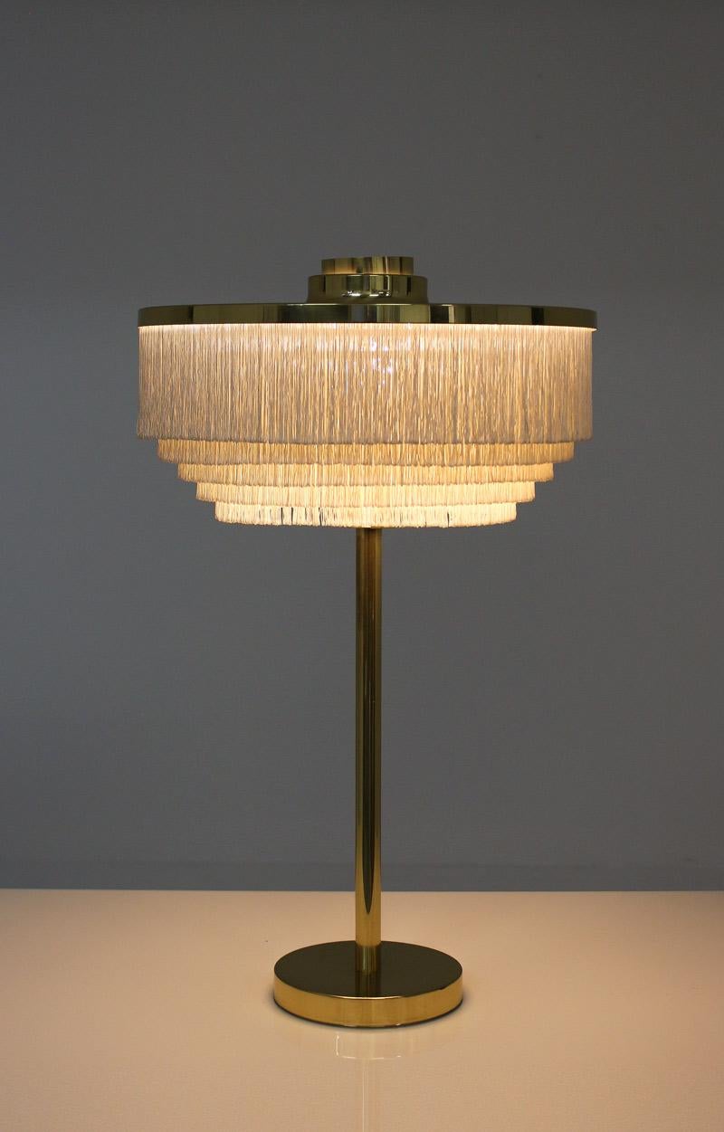 Table lamp model T138 by Hans-Agne Jakobsson, Markaryd.
This lamp is possibly the rarest and most sought-after model in Hans-Agne’s fringe series.
Condition: Close to excellent original condition.

 