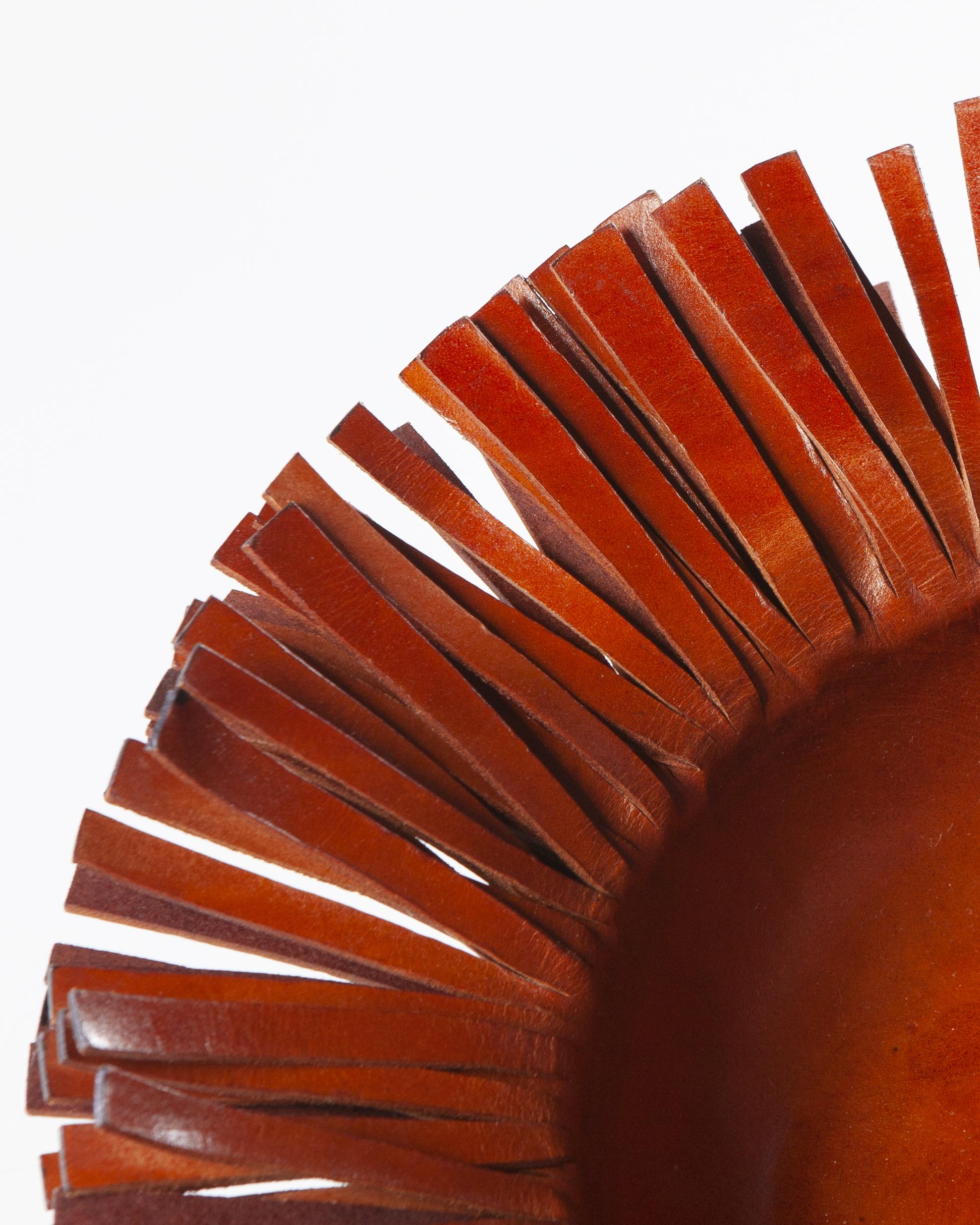 This handmade fringed leather bowl is the perfect centerpiece to complete your dining room table or any room in your home. Rustic charm meets contemporary handcrafted design sensibility in this exquisite bowl.

Size: 12