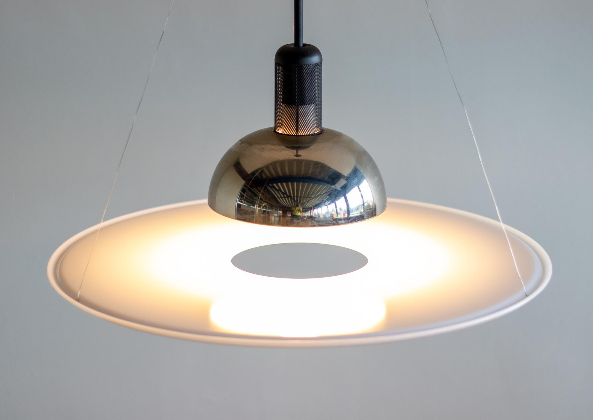 Suspension lamp providing direct, diffused and reflected light. 
Original early edition purchased directly from 1st owner.
A great classic.
