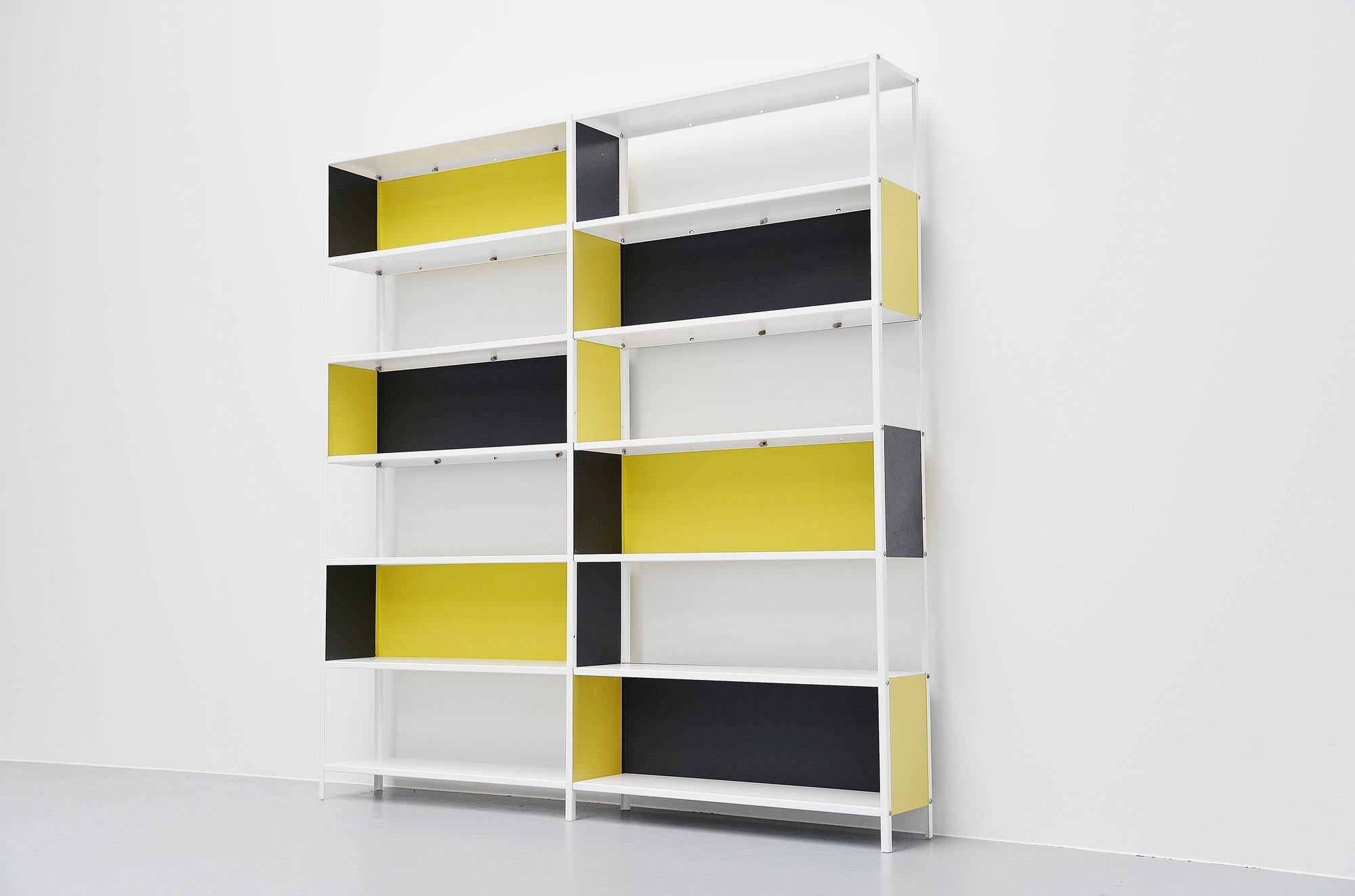Rare double metal bookcase and shelving unit designed by Friso Kramer for de Beijenkorf, produced by Asmeta in 1953. Martin Visser commissioned Friso Kramer to design a simple usable shelving unit for de Bijenkorf. These bookcases were designed in