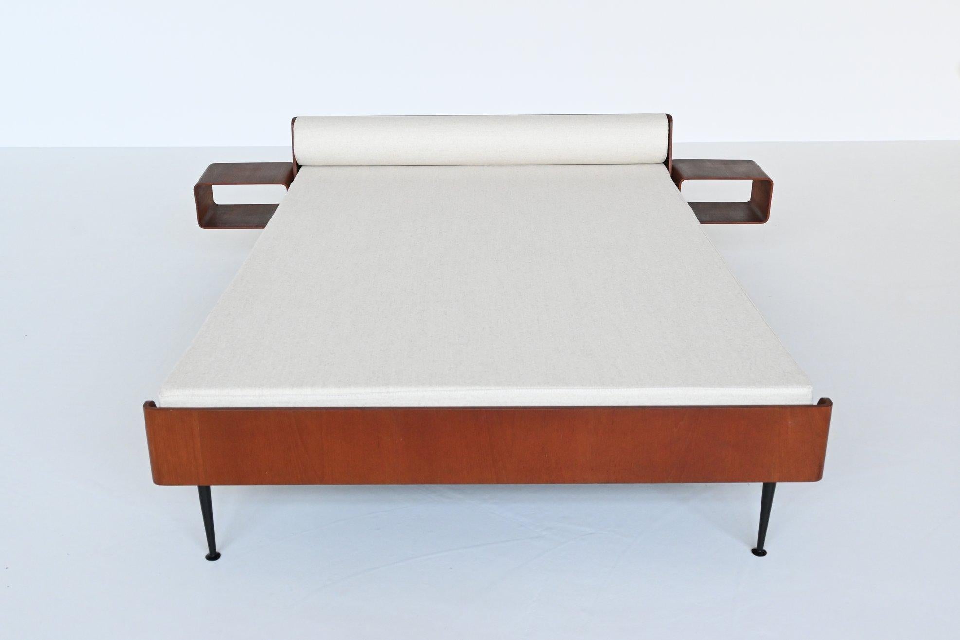 Beautiful shaped double bed from the Euroika series designed by Friso Kramer for Auping, The Netherlands 1963. Friso Kramer designed also from this series: bed, bed cabinets, table, chair, mirror and a toilet cabinet. This bed has a black coated