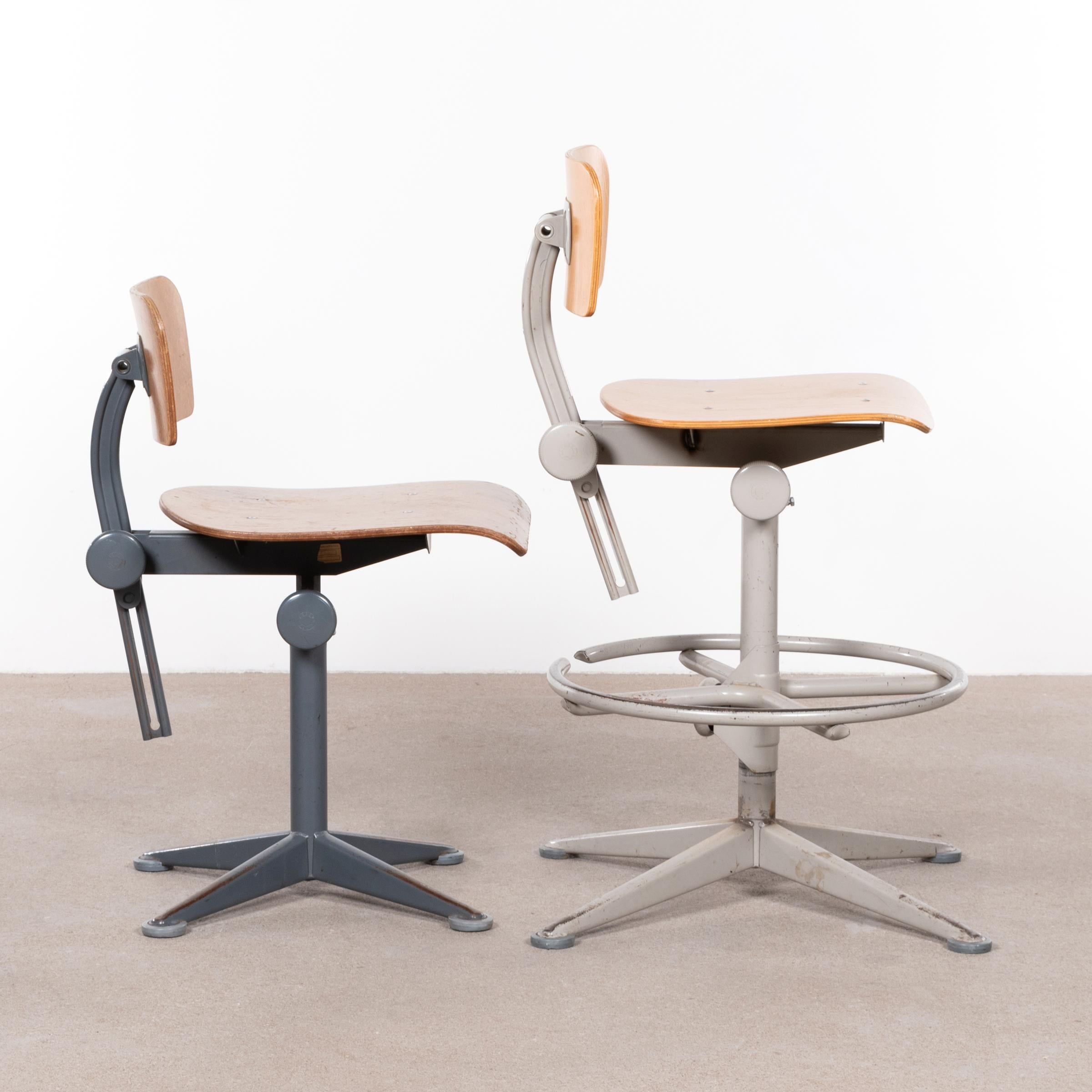 Functional and industrial drafting stools (arhitect stools) by Friso Kramer. The stools are adjustable in seating height and swivel. Good vintage condition with steel bases and plywood seats / back rest. Signed with impressed manufacturer's