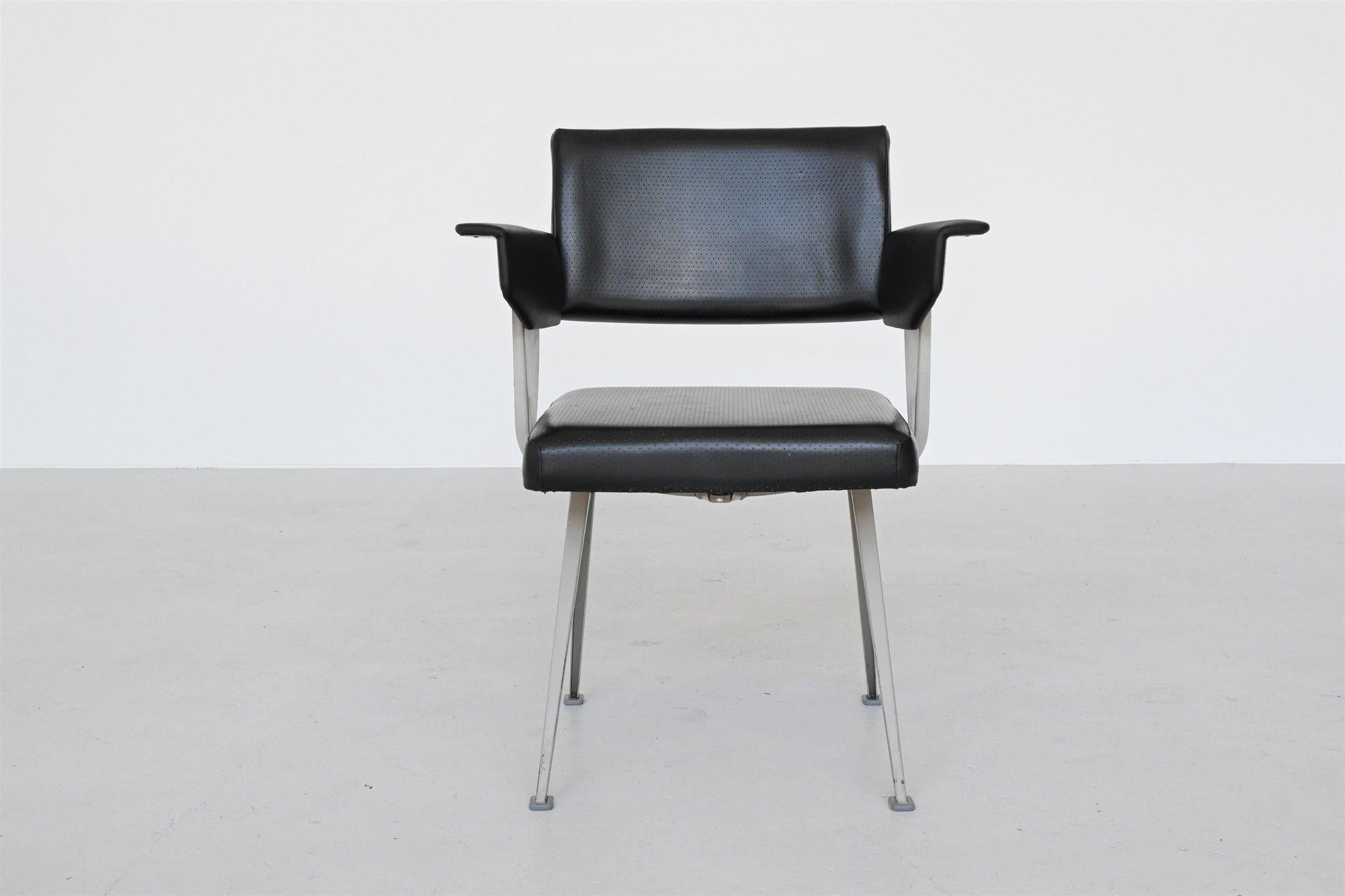 Industrial Resort armchair designed by Friso Kramer, manufactured by Ahrend de Cirkel, the Netherlands, 1960. The chair has a grey lacquered metal frame with V structure legs. The seat, back and arms are upholstered in black faux leather and are in