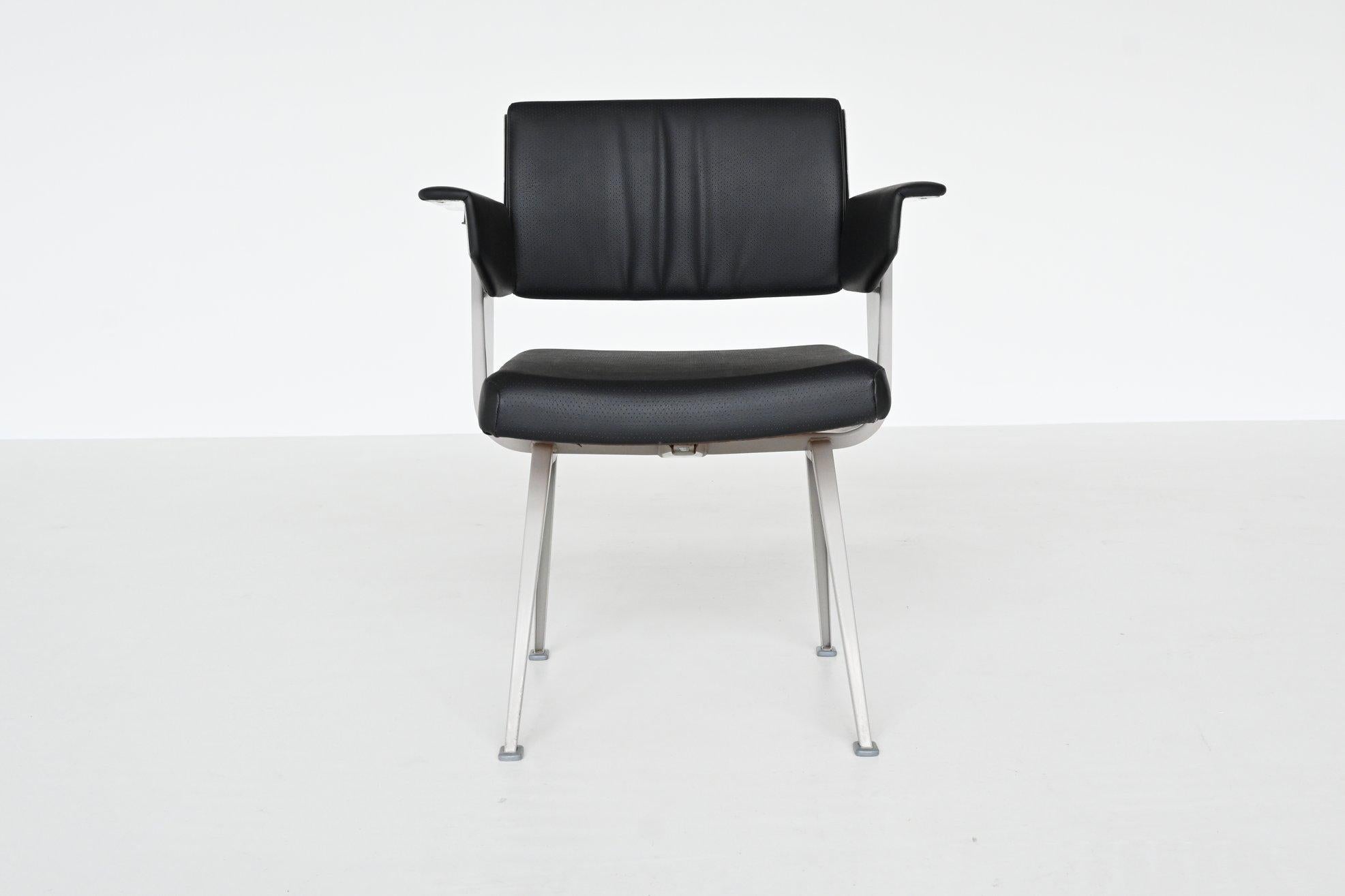 Industrial Resort armchair designed by Friso Kramer, manufactured by Ahrend de Cirkel, The Netherlands 1960. The chair has a grey lacquered metal frame with V structure legs. The seat, back and arms are upholstered in black faux leather and are in
