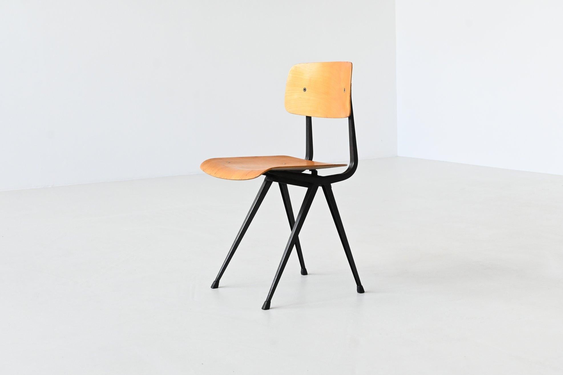 Very nice iconic chair model Result designed by Friso Kramer for Ahrend de Cirkel, The Netherlands 1958. The chair has an original black lacquered metal frame with V structure legs which is very nice in combination with the birch plywood seat and