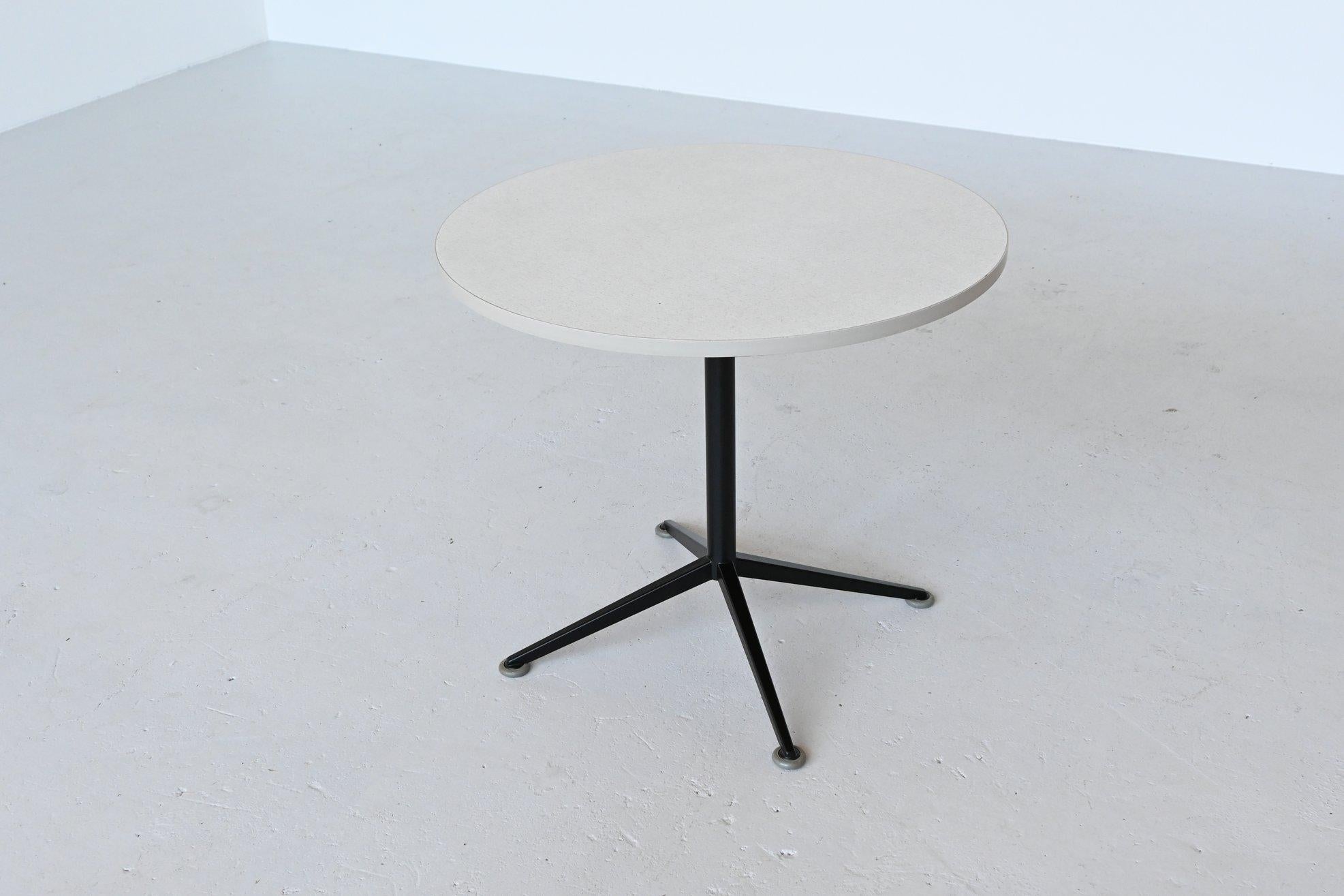 Super rare dining table designed by Friso Kramer for Ahrend de Cirkel, the Netherlands, 1965. This table is from the Eindhoven University of Technology. Very nicely shaped table with black coated metal legs, grey rubber feet and a white Formica top.
