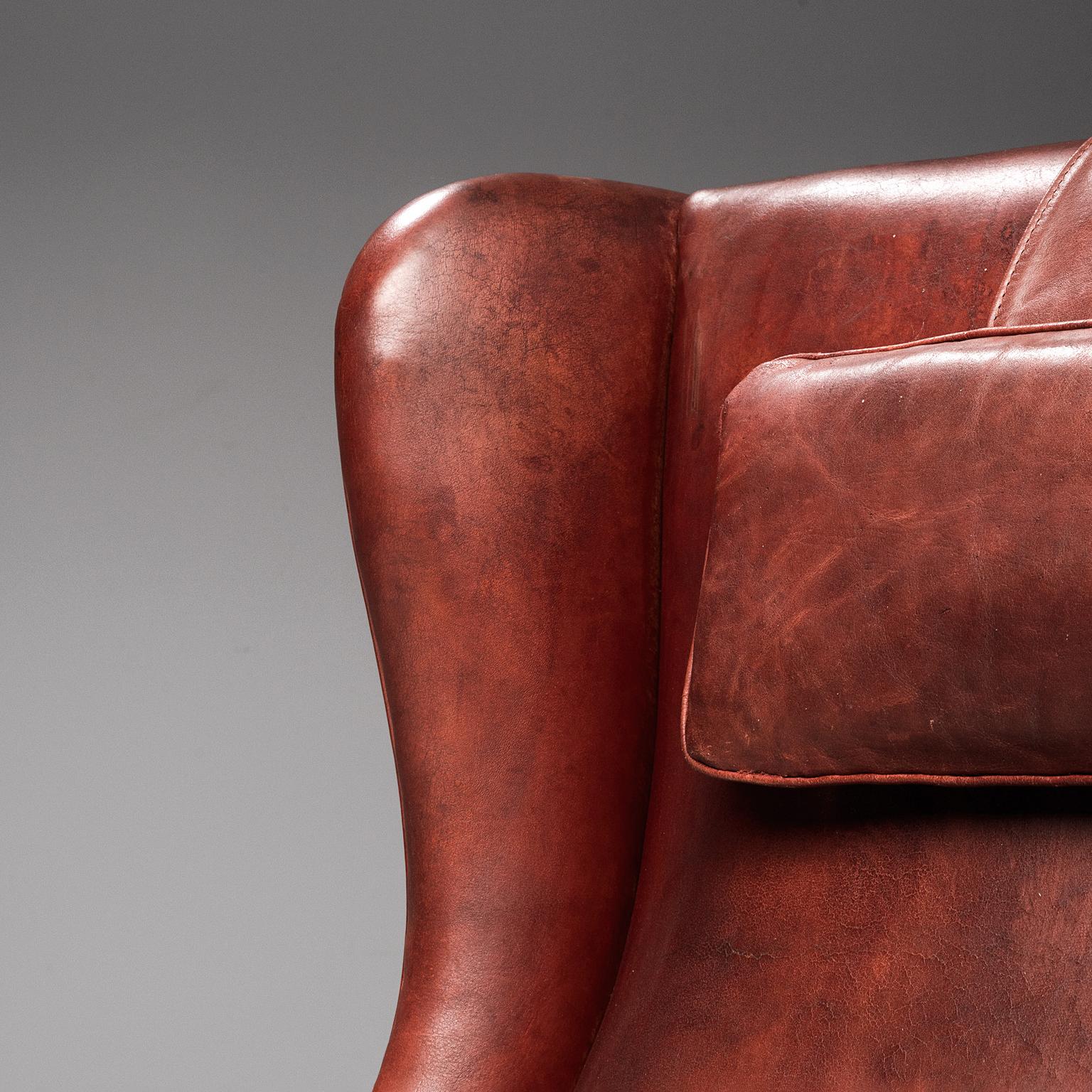 burgundy leather chair and ottoman