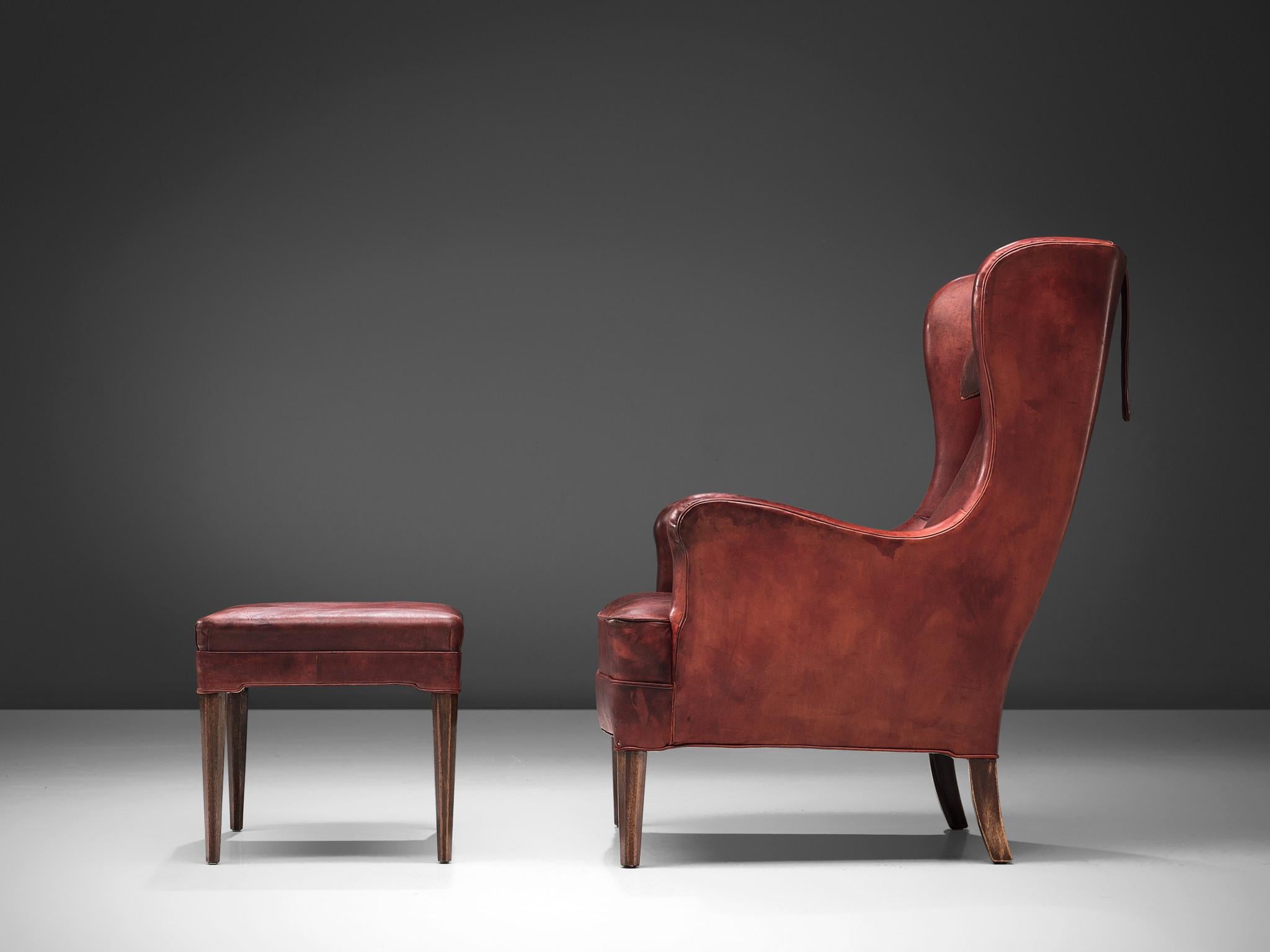 Scandinavian Modern Frits Henningsen Lounge Chair with Ottoman in Original Burgundy Leather For Sale