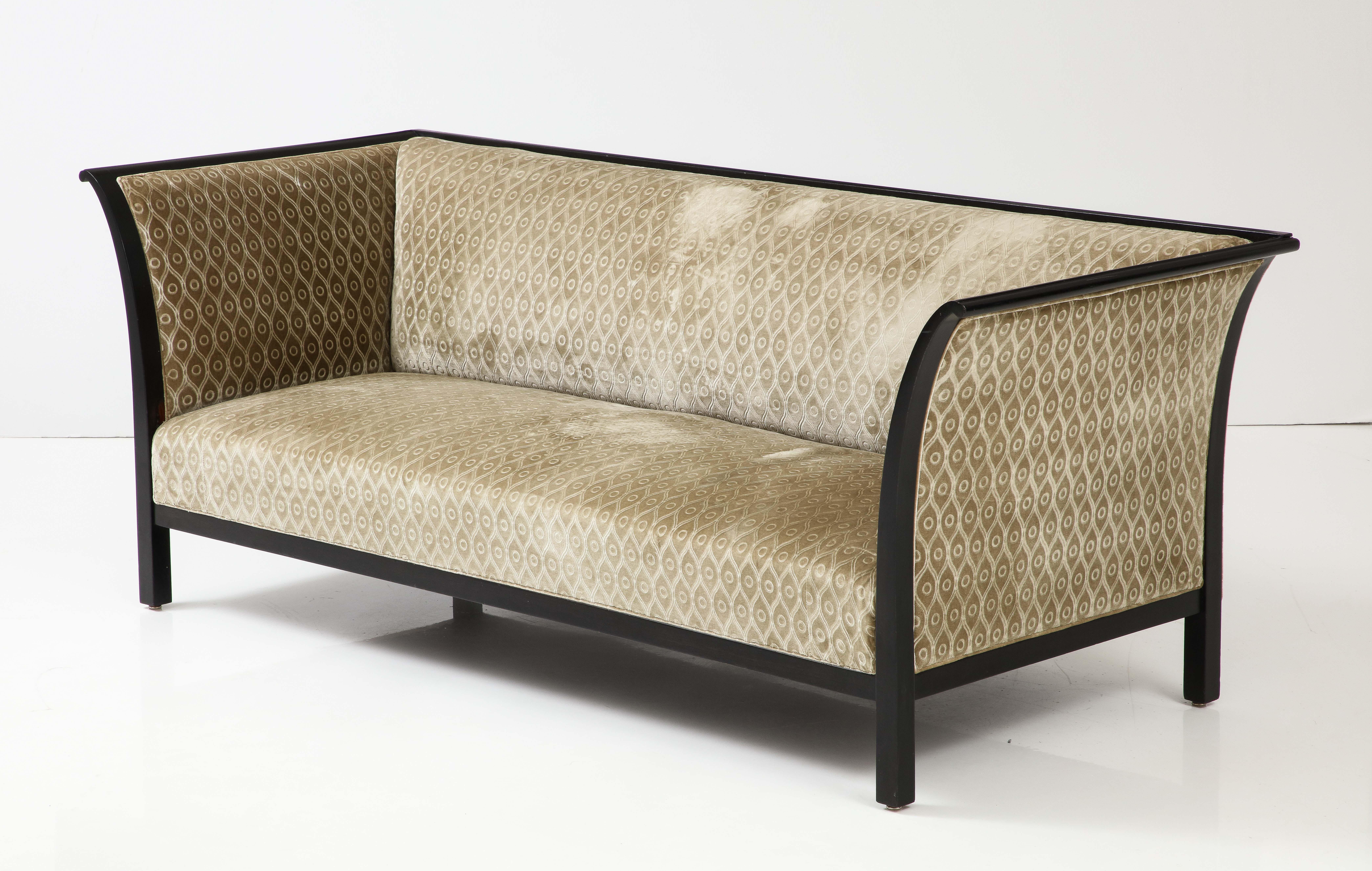 A beautiful classic original Art Deco sofa by a famed Danish craftsman, Frits Henningsen. 1030. Original fabric