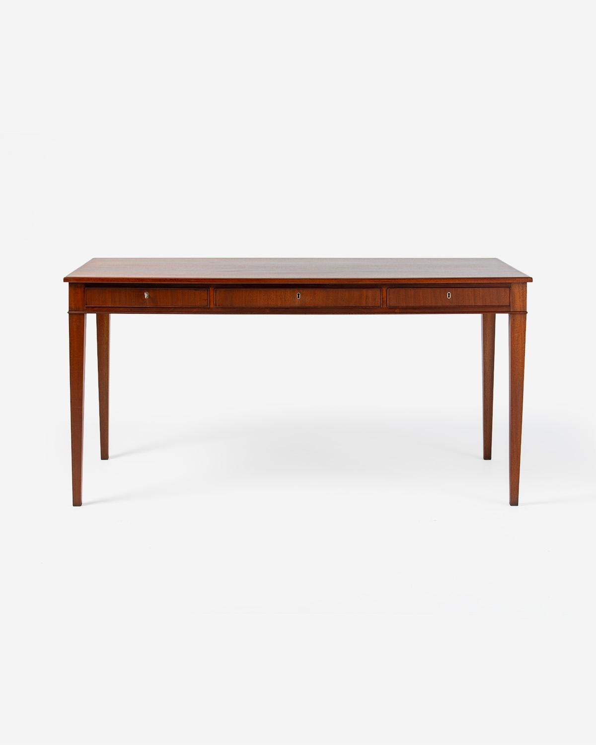 Frits Henningsen - Mahogany Writing Desk, 1940s

Rarely seen design from master cabinetmaker of the early Danish Modern period: Frits Henningsen. Henningsen produced all of his designs at his own workshop in Denmark in limited volumes. This