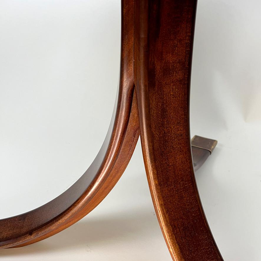 Brass Frits Henningsen. A Cuban mahogany circular pedestal  table. For Sale