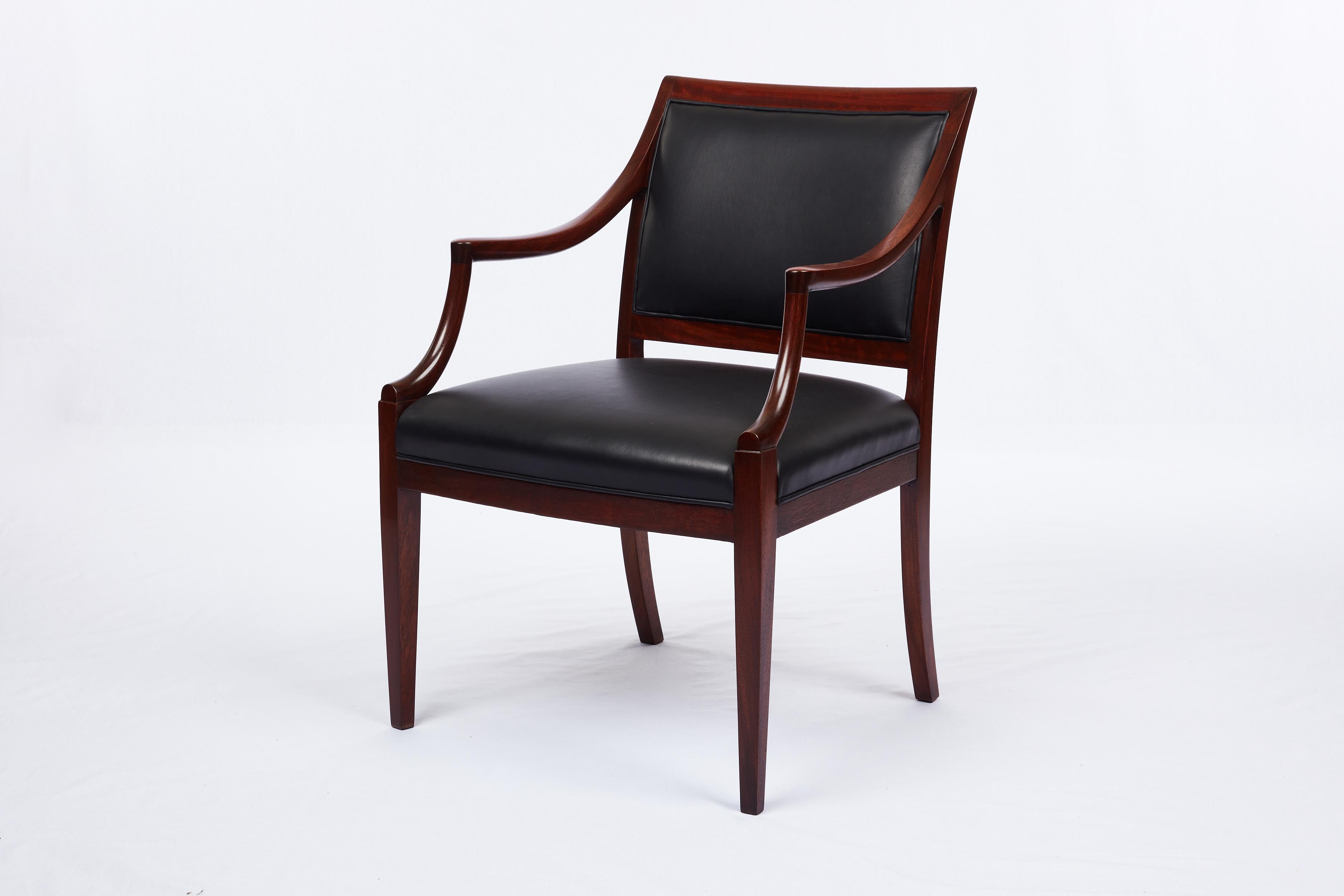 Frits Henningsen armchair. Wood is Mahogany. New black leather. 1940's.
 