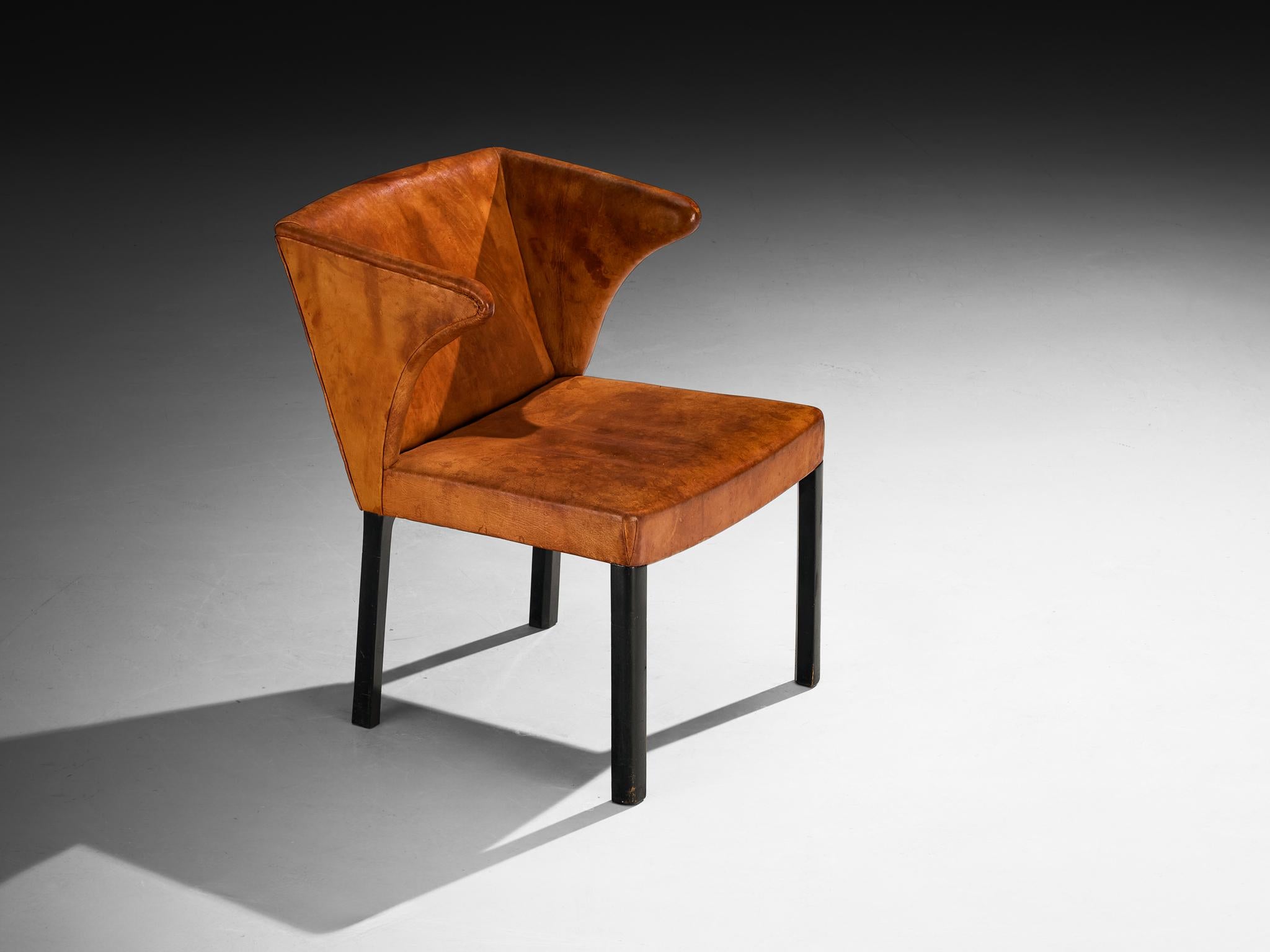 Frits Henningsen, armchair, Niger leather, lacquered wood, Denmark, design 1933, made 1930s/1940s

First unveiled at the 1933 Copenhagen Cabinetmakers' Guild Exhibition at Designmuseum Danmark, this chair by Frits Henningsen was highly favored by
