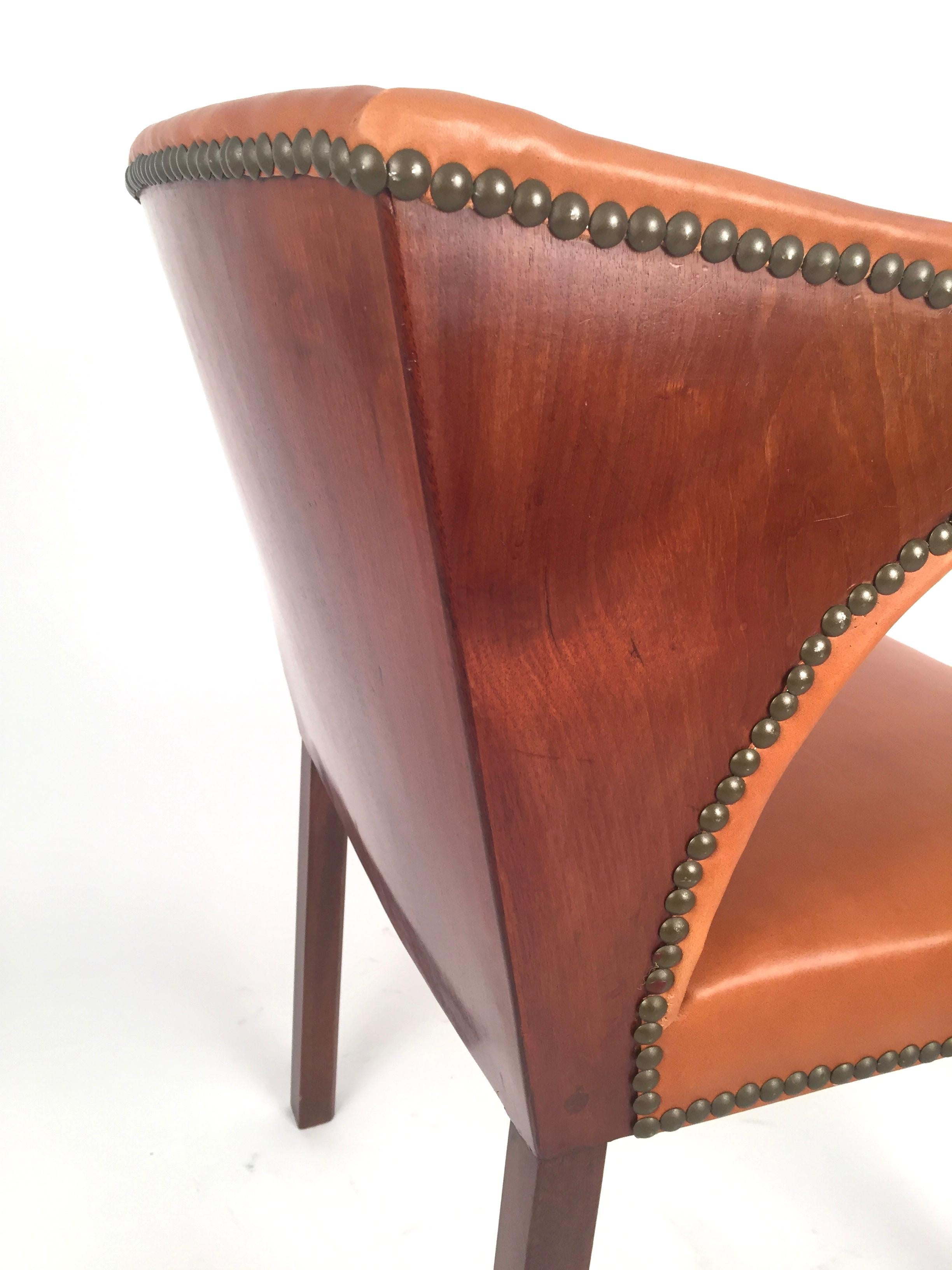 An armchair designed and edited by Frits Henningsen in 1933. Cuban mahogany frame ;professionally reupholstered in brown leather. Brass nails. Excellent condition. Shipping worldwide.Free professional packing and shipping is provided.