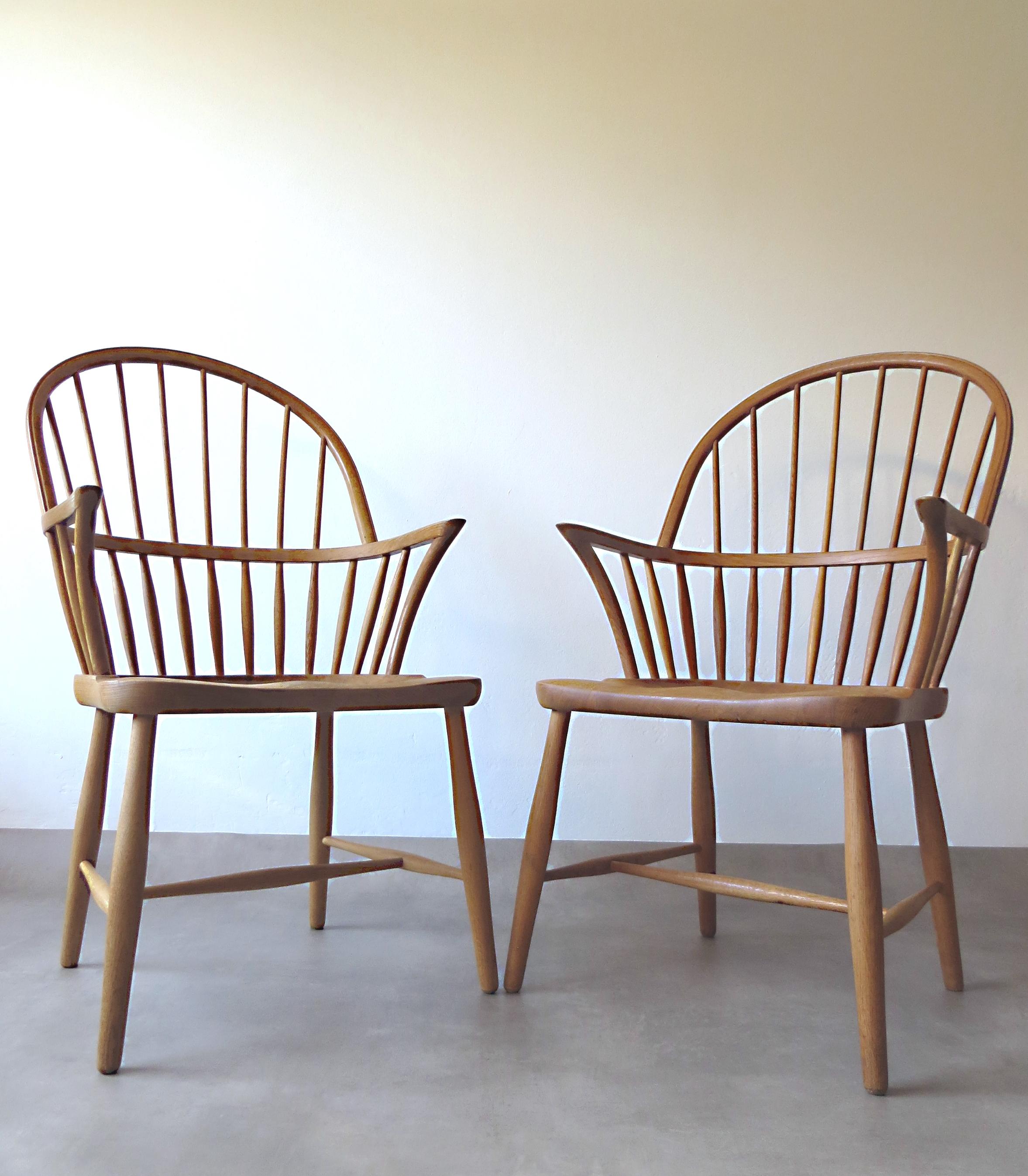 Finest, exclusive and very rare Denmark Scandinavian vintage high back windsor design classic armchairs in highest quality with beautiful patinated wood grain from the solid oak frame. 
Design is from the renowned cabinetmaker Frits Henningsen in