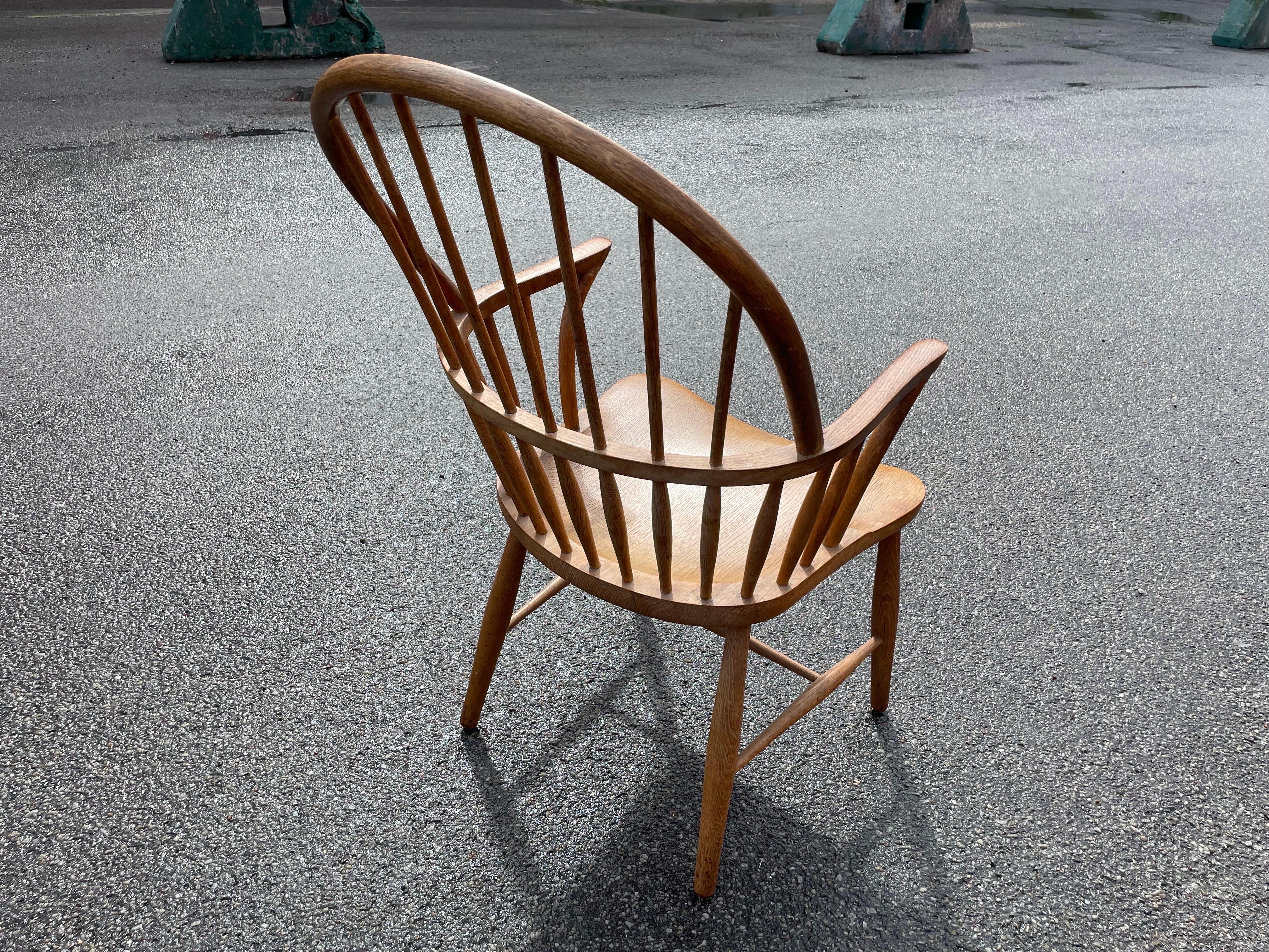 The iconic Windsor Chair, a masterpiece born from the creative genius of Danish architect and cabinetmaker Frits Henningsen in 1938. Embodying an enchanting blend of form and function