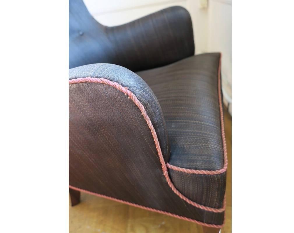This lounge chair was designed and made by cabinetmaker Frits Henningsen in the 1940s or 1950s. The horsehair is original and shows patina evidence of age. The ottoman / footstool has two places where the horsehair is worn through.