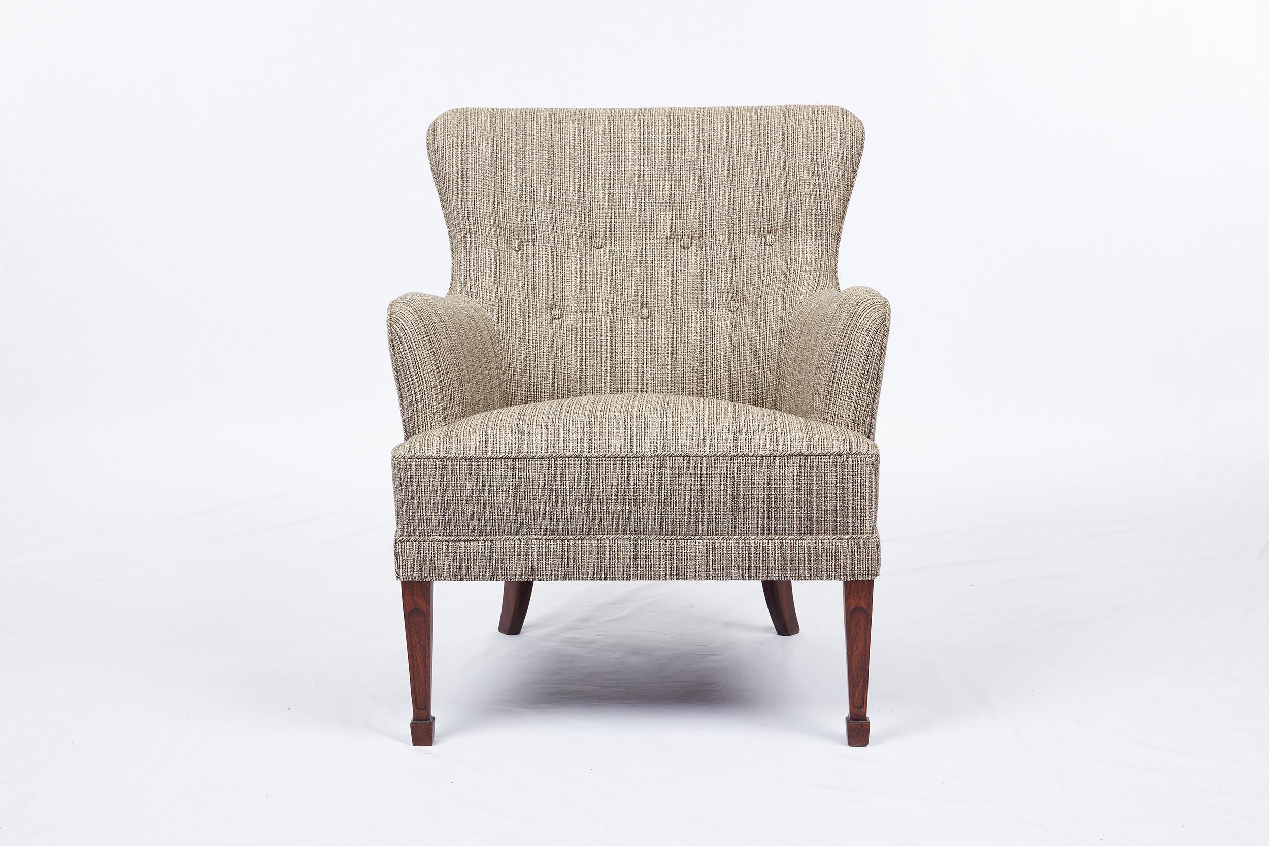 Frits Henningsen lounge chair. Legs are Mahogany. Refinished and Reupholstered.
 