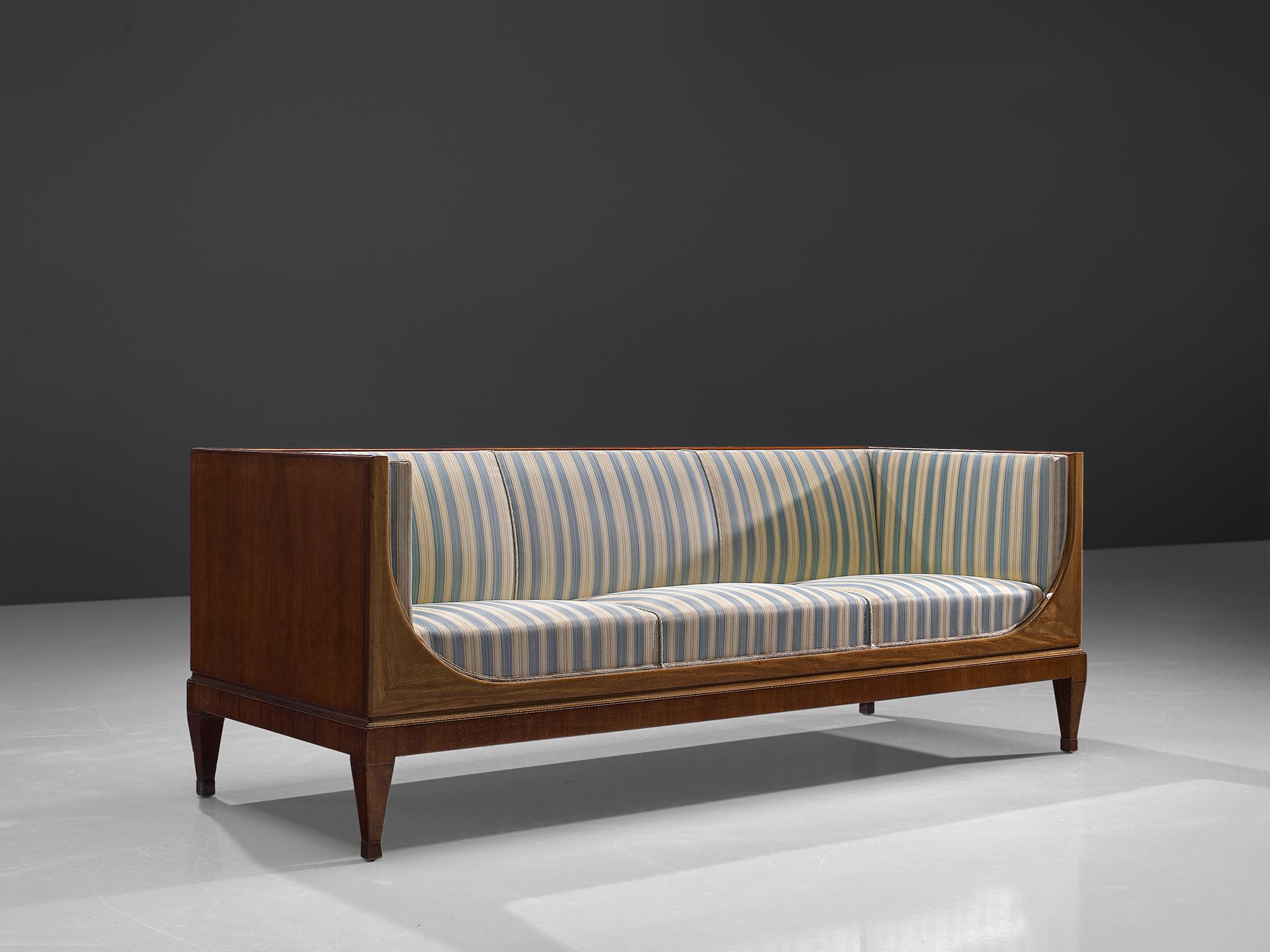 Frits Henningsen, sofa, mahogany and blue and white striped fabric, Denmark, 1930s.

This Classic sofa was designed and produced by master cabinet maker Frits Henningsen, circa 1930s. The basic design is well balanced, showing an interesting