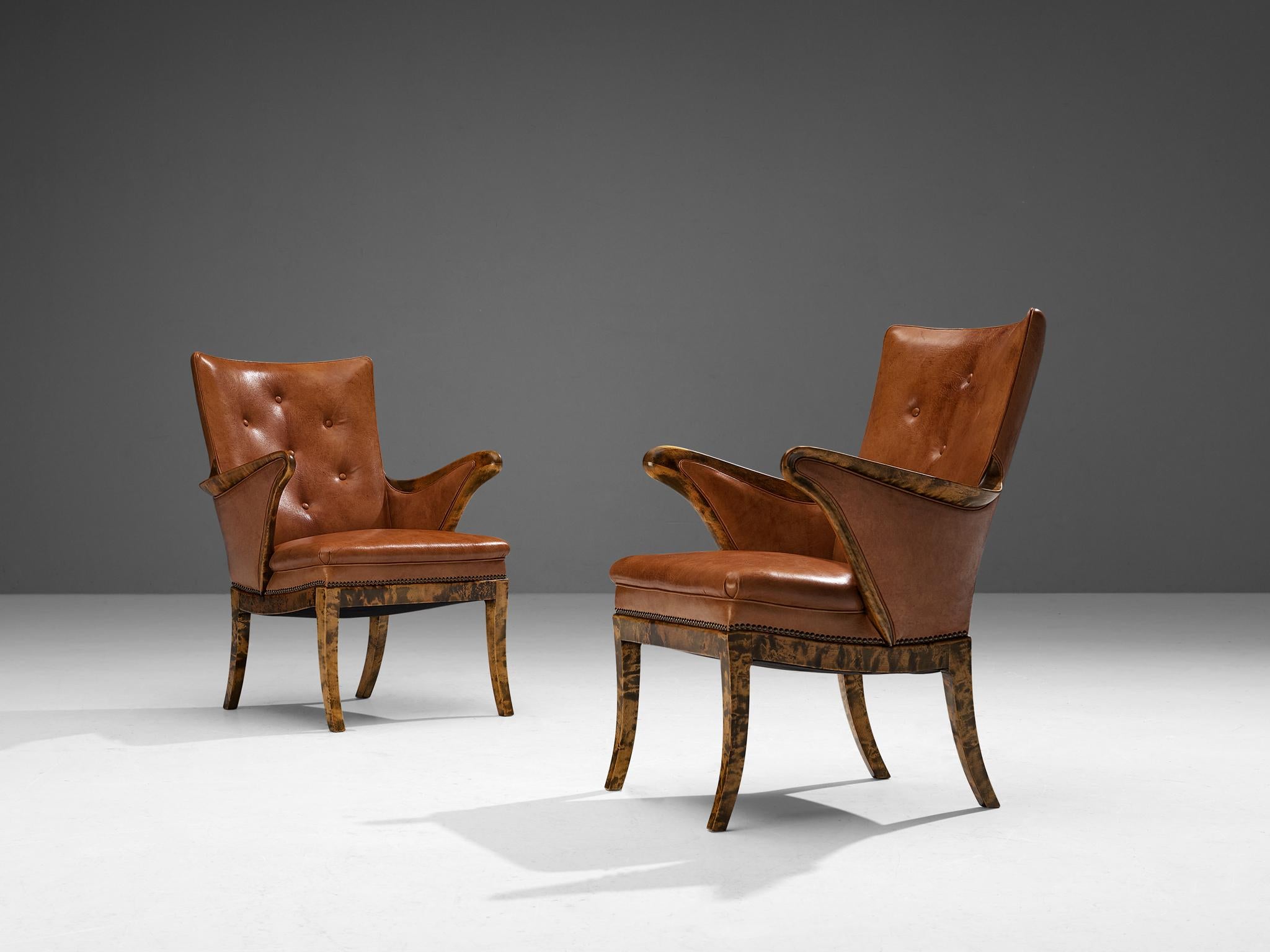 Frits Henningsen, pair of armchairs, birch, Niger leather, Denmark, 1932

Pair of very elegant armchairs with strong lines throughout the design. These chairs are made in the 1930s in Denmark. The whole silhouette of these chairs is in harmony and