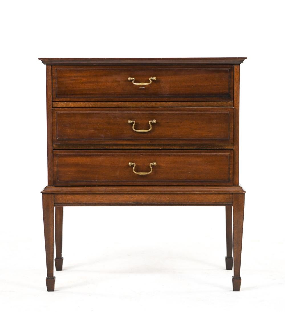 A rare Danish diminutive chest of drawers by Frits Henningsen in mahogany, featuring brass bale handles and spade feet. This handsome three-drawer chest is a fine example of Danish transitional traditional-to-modern design, c. 1940's.