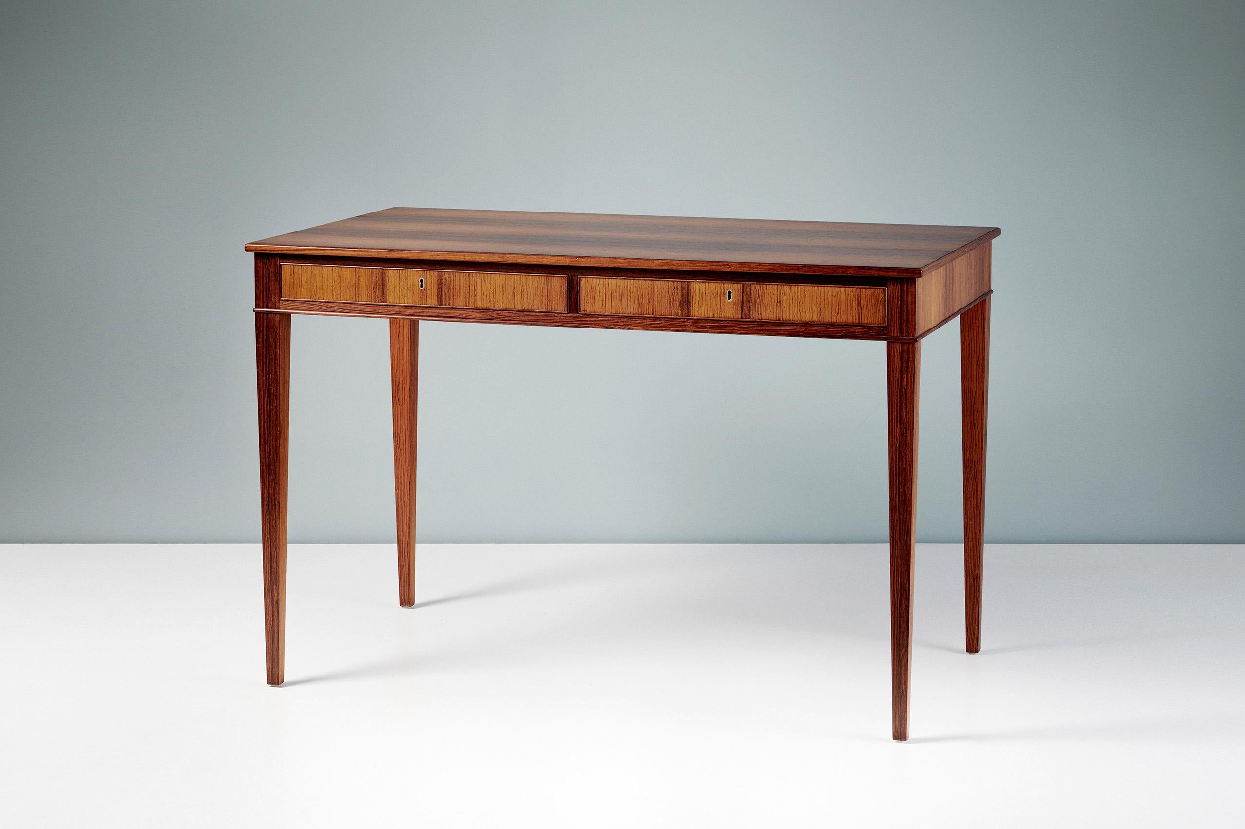 Frits Henningsen - Writing Desk, c1940s

Rarely seen design from the master cabinetmaker of the early Danish Modern period: Frits Henningsen. Henningsen produced all of his designs at his own workshop in limited volumes. This exquisite, classical