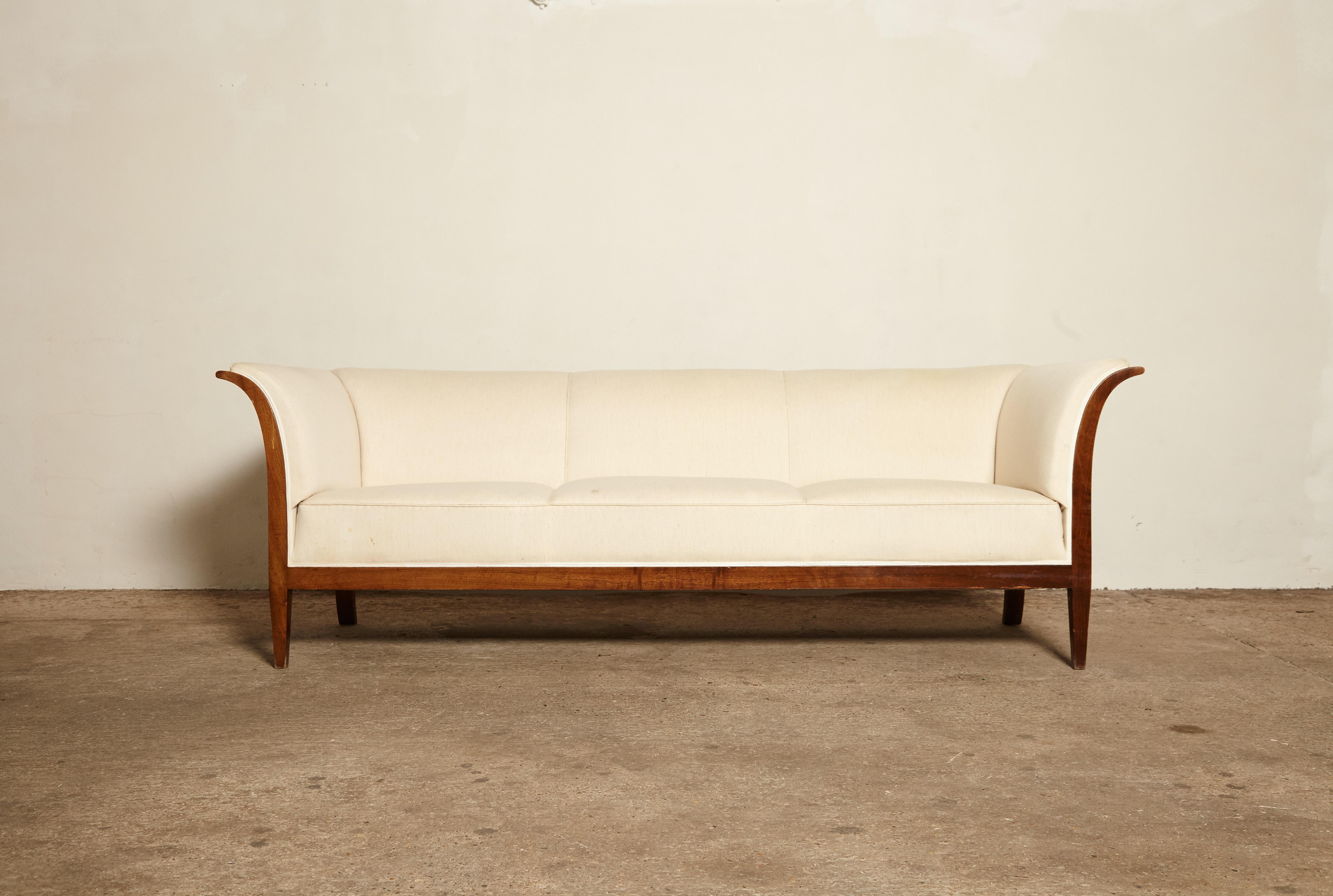 An original Frits Henningsen sofa, Denmark, 1940s-1950s for re-covering. Designed and produced by Frits Henningsen, Copenhagen. The fabric is stained and has some damage so this sofa requires re-covering. We can assist with re-covering if required.