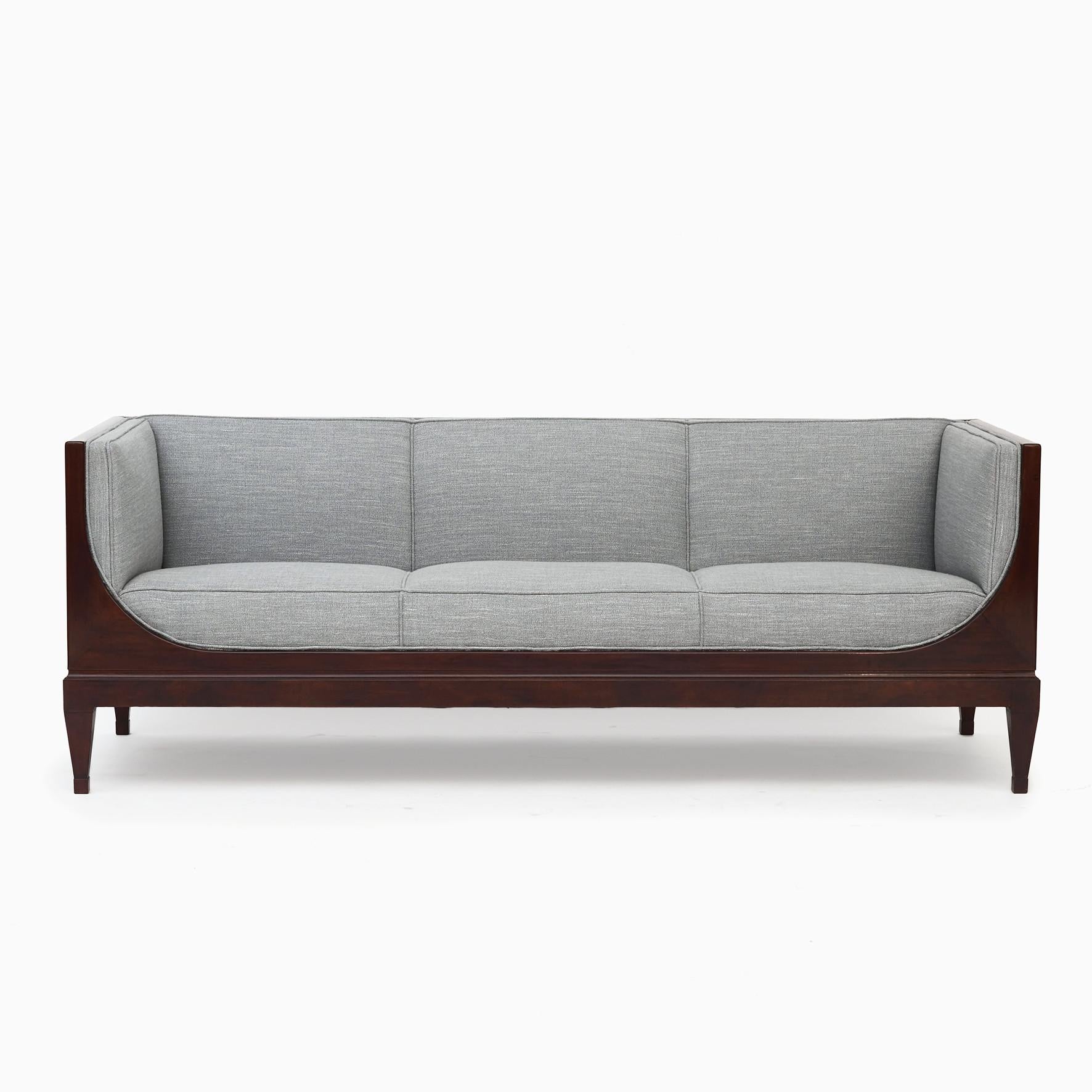Frits Henningsen sofa from 1889-1965.
Mahogany sofa made in high quality at own carpentry in 1940-1950.
Mahogany refinished with a light French polish.
Seat height 45 cm.
Newly upholstered in wool-linen blend from Larsen.

Literature: Bodil Busk