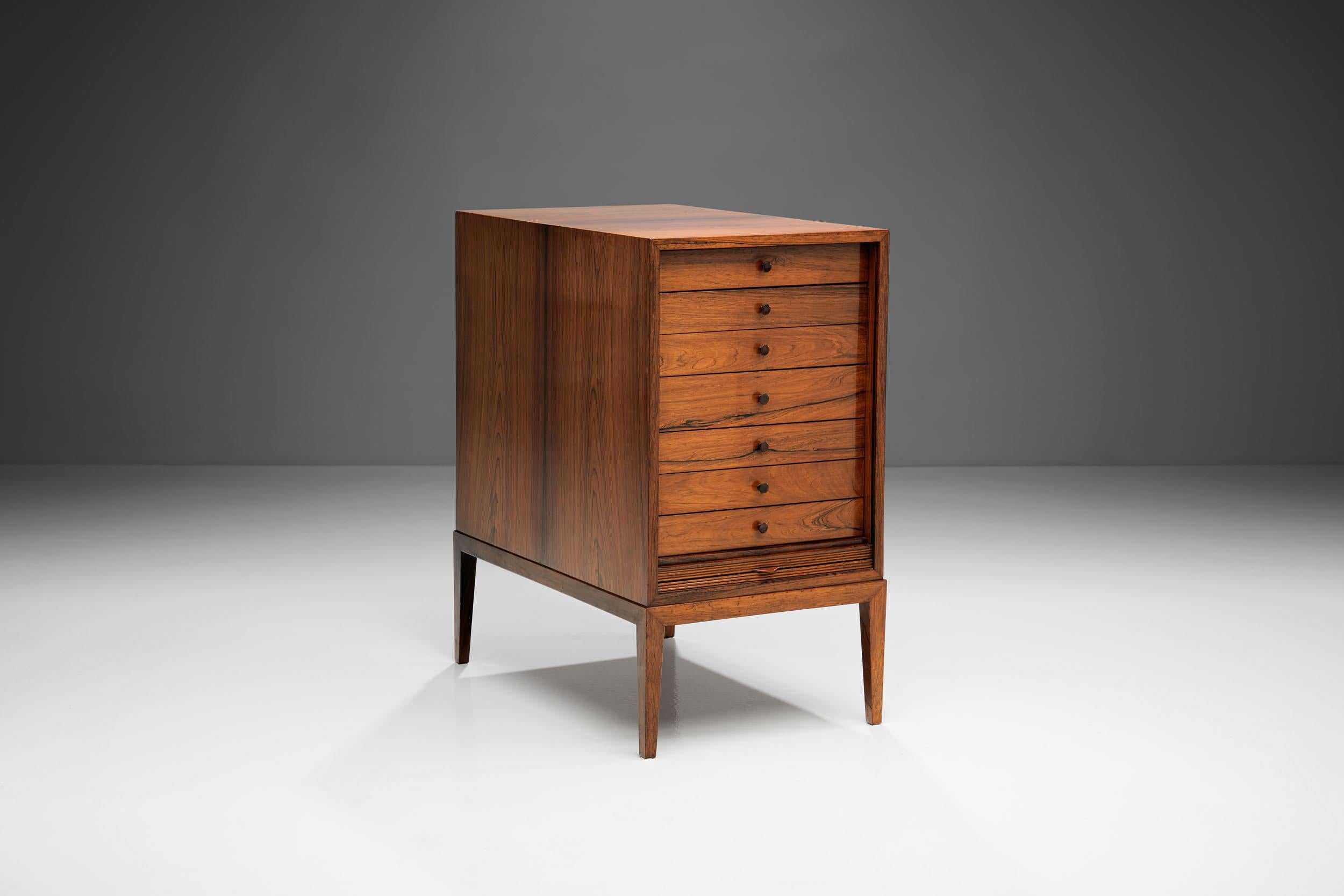 Classic design with expert craftsmanship. This how this cabinet and the Danish master cabinetmaker, Frits Henningsen could be best described. Unlike most cabinetmakers, Henningsen always designed his own furniture pieces, creating exclusively