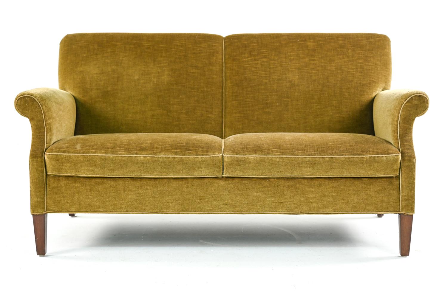 Danish mid-century two-seater sofa in the manner of Frits Henningsen, in original upholstery.