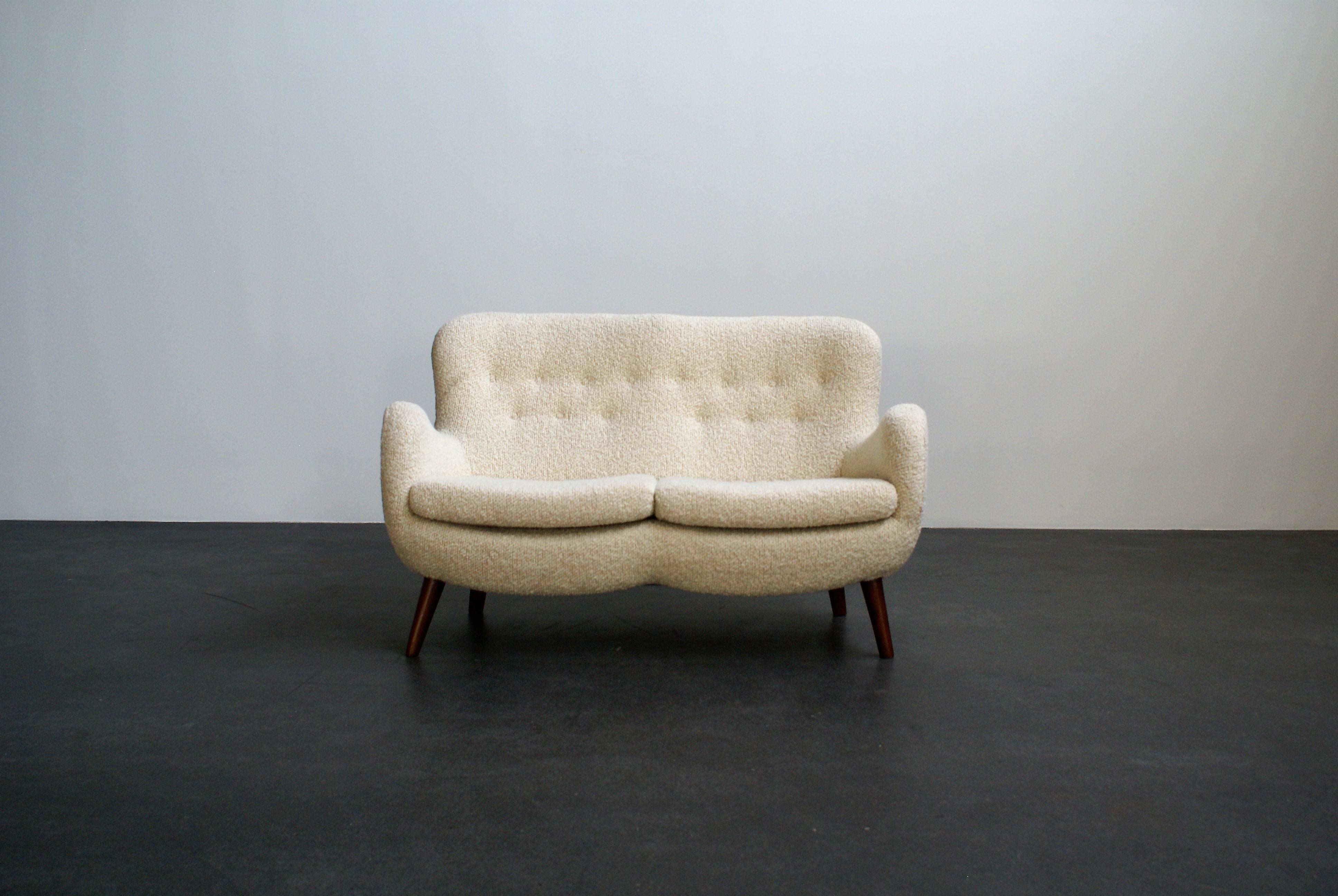 2-seater settee attributed to Frits Schlegel. Stained beech tapering legs and reupholstered in fabric. Made Denmark, 1940s.