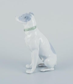 Fritz and Ilse Pfeffer, Gotha, Germany. Porcelain figurine of a seated dog.