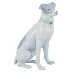 Antique Fritz and Ilse Pfeffer, Gotha, Germany. Porcelain figurine of a seated dog.