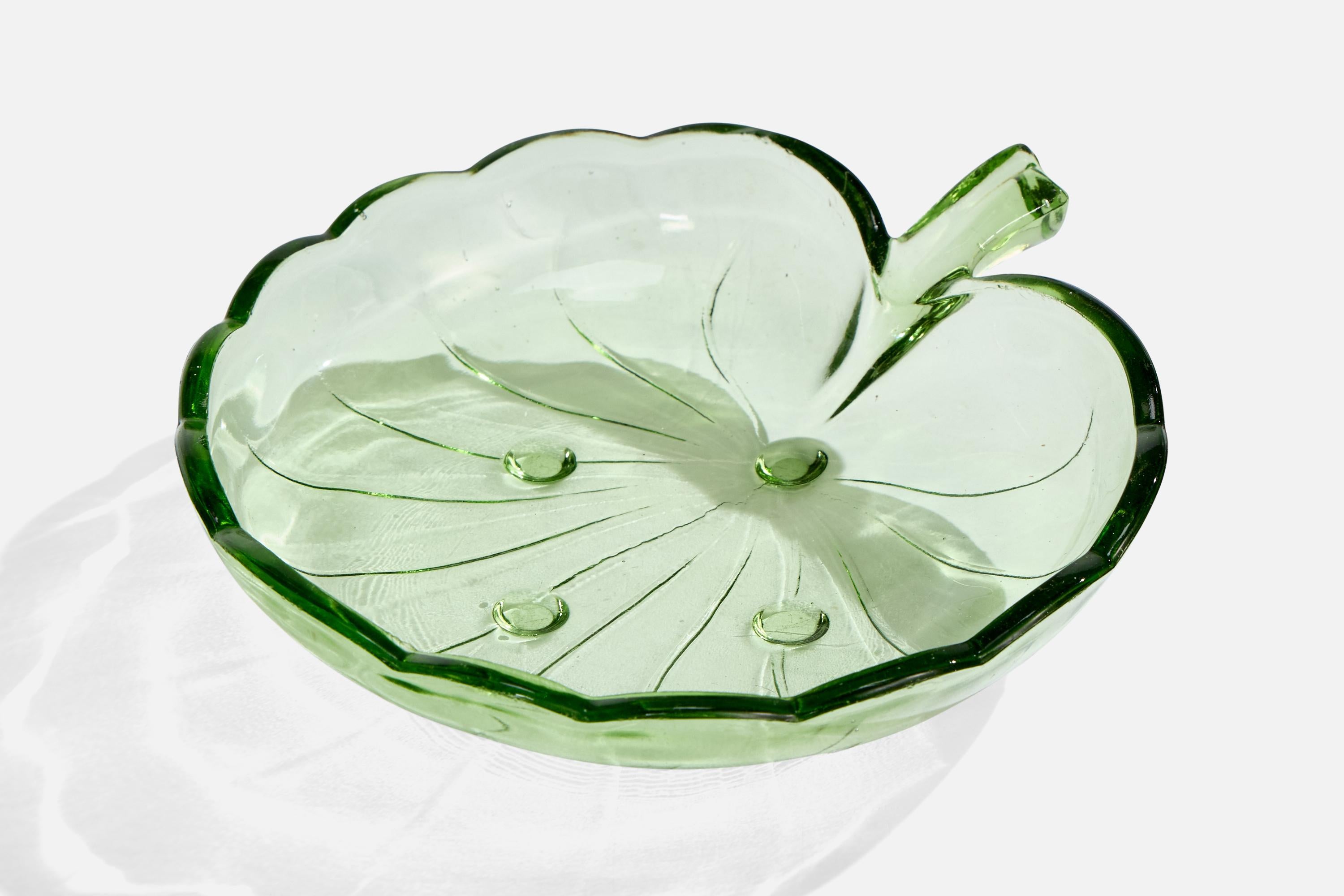 A green-colored glass bowl designed by Fritz Dahl and produced by Hovmantorp Glasbruk, Sweden, c. 1950s.

Overall Dimensions (inches): 1.9