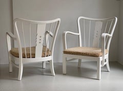 Fritz Hansen 1930s Pair of danish easy chairs in matte white paint and sheepskin