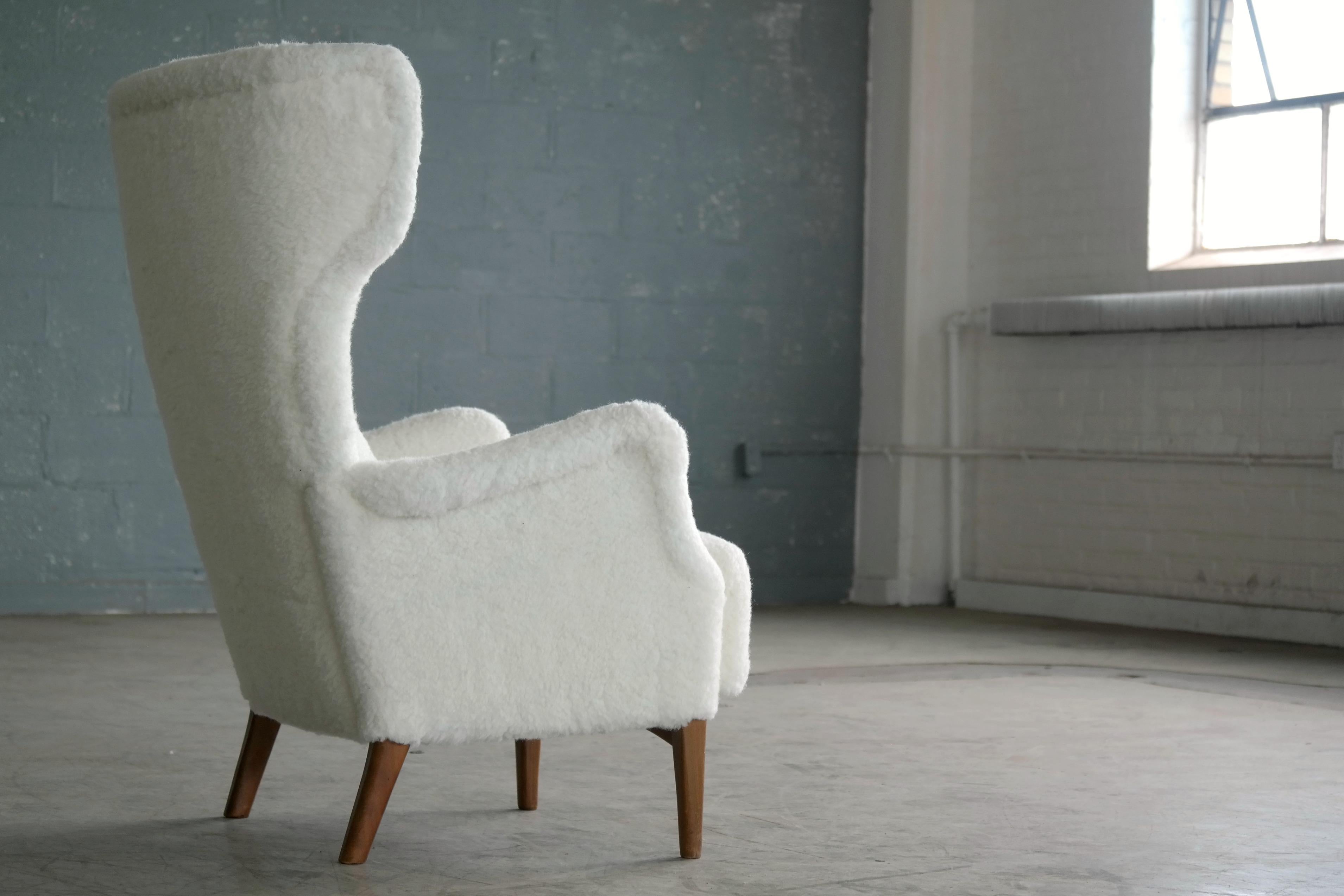 Mid-20th Century Fritz Hansen 1950s Danish Wingback Chair Model 8023 with Ottoman in Lambs Wool