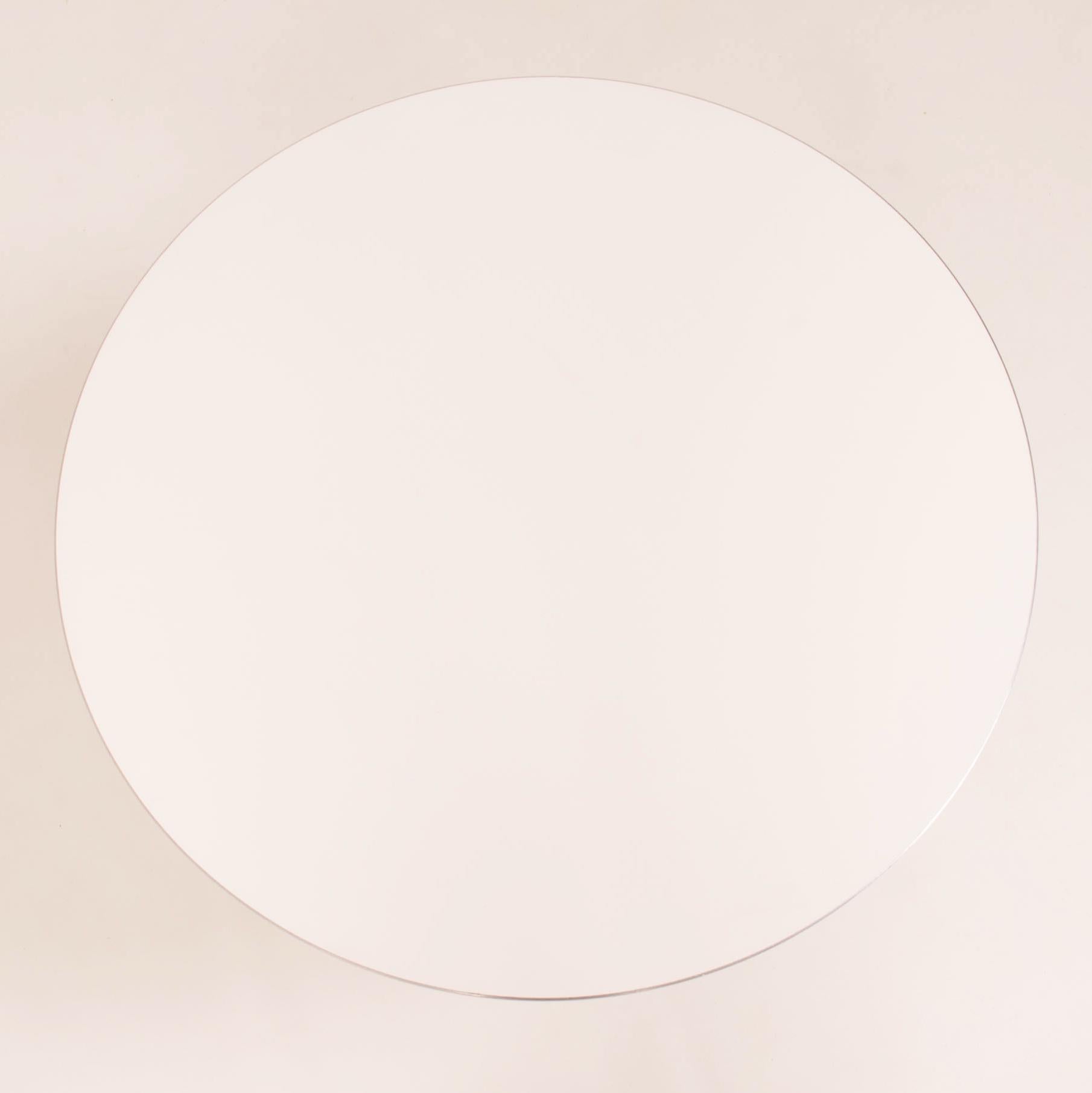 Originally designed in 1968 by Piet Hein, Bruno Mathsson and Arne Jacobsen, the A622 table is manufactured by Fritz Hansen in Denmark.

The modern contemporary round table features a circular white laminate top with an aluminium edge, sitting on a