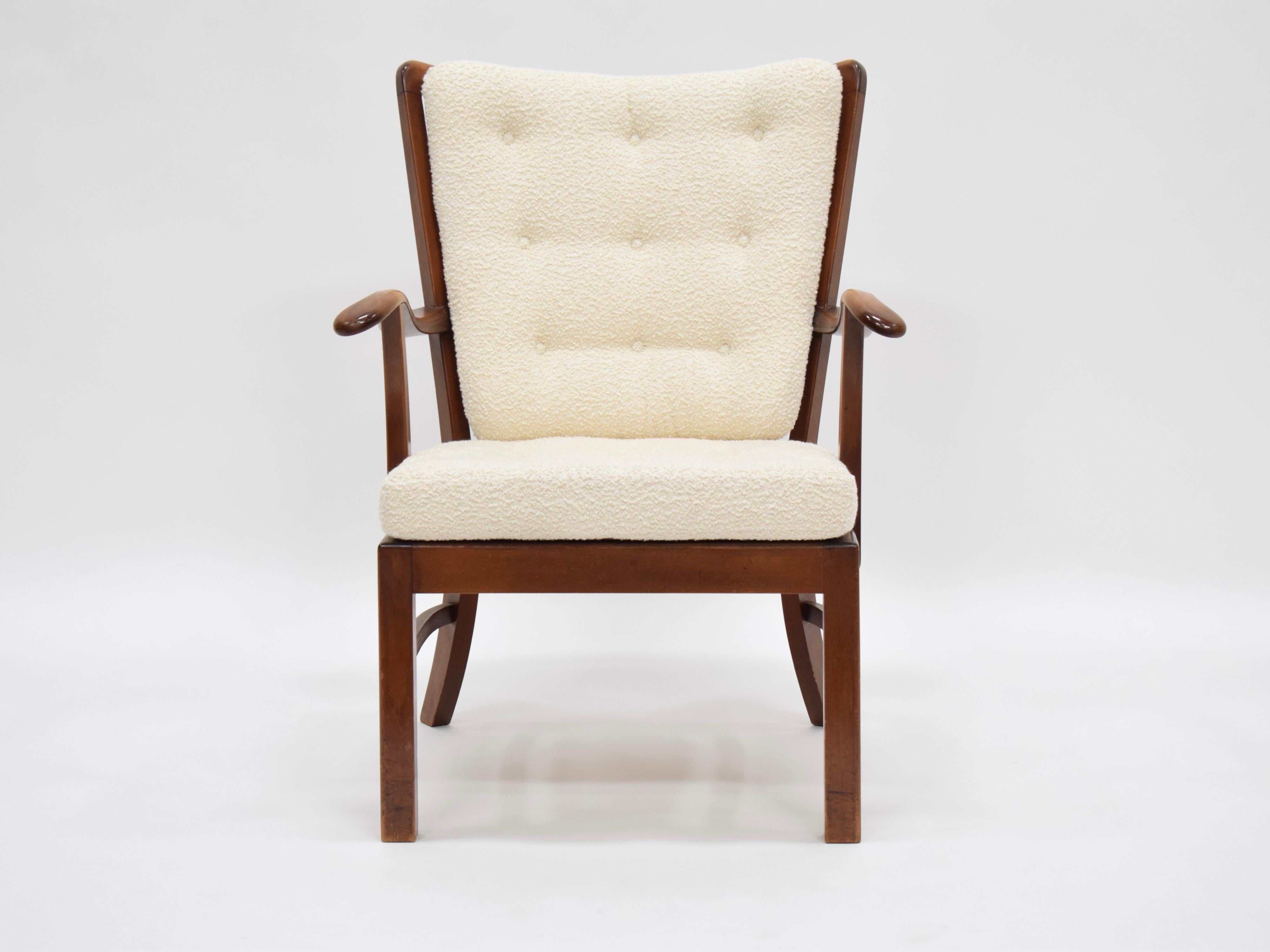 Fritz Hansen walnut-stained oak armchair upholstered in cream boucle
