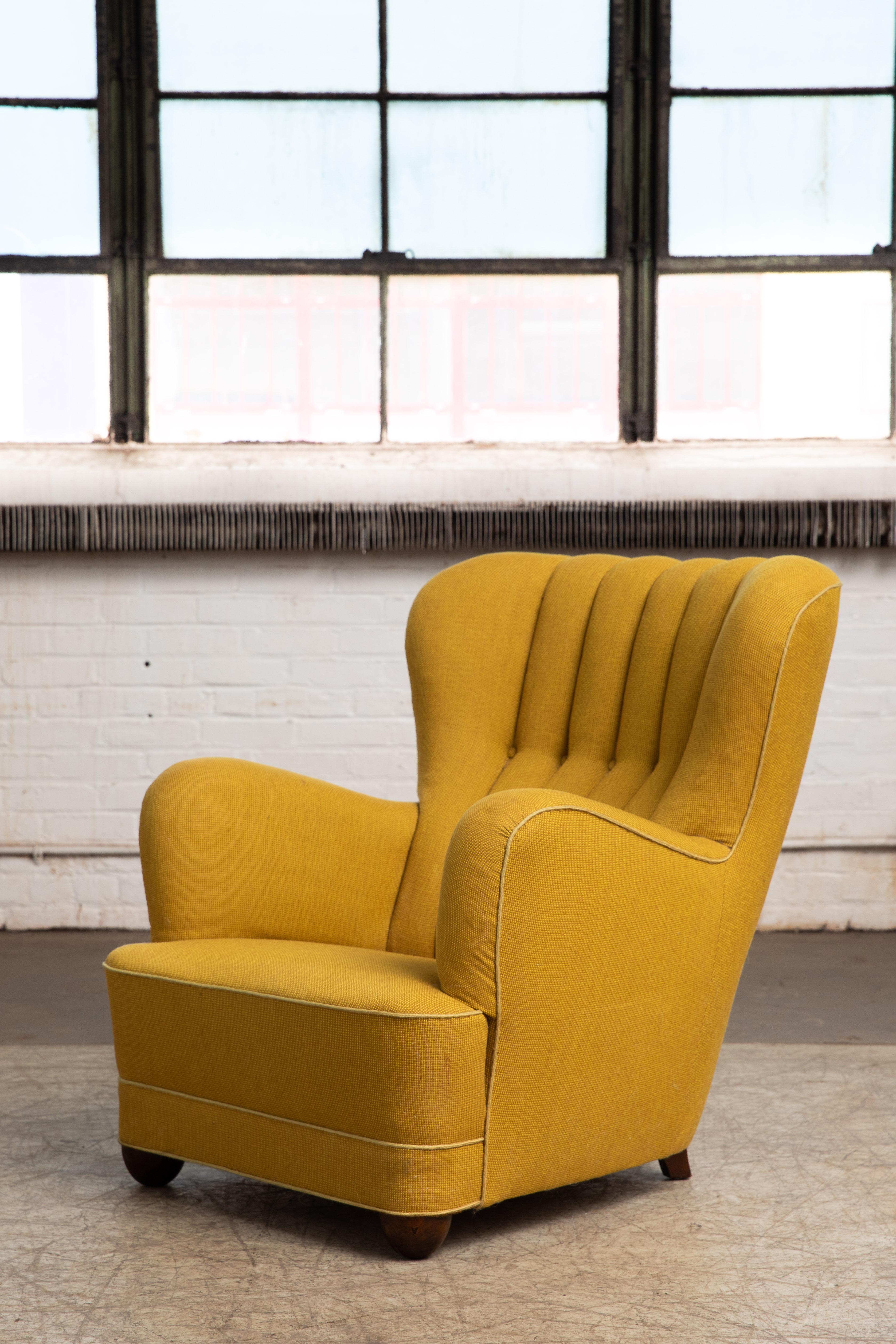 Sublime highback lounge chair with channeled back made in Denmark in the late 1930s or early 1940s. This model chair is seen from time to time in the Danish market and is often attributed to Fritz Hansen, but unfortunately the Fritz Hansen