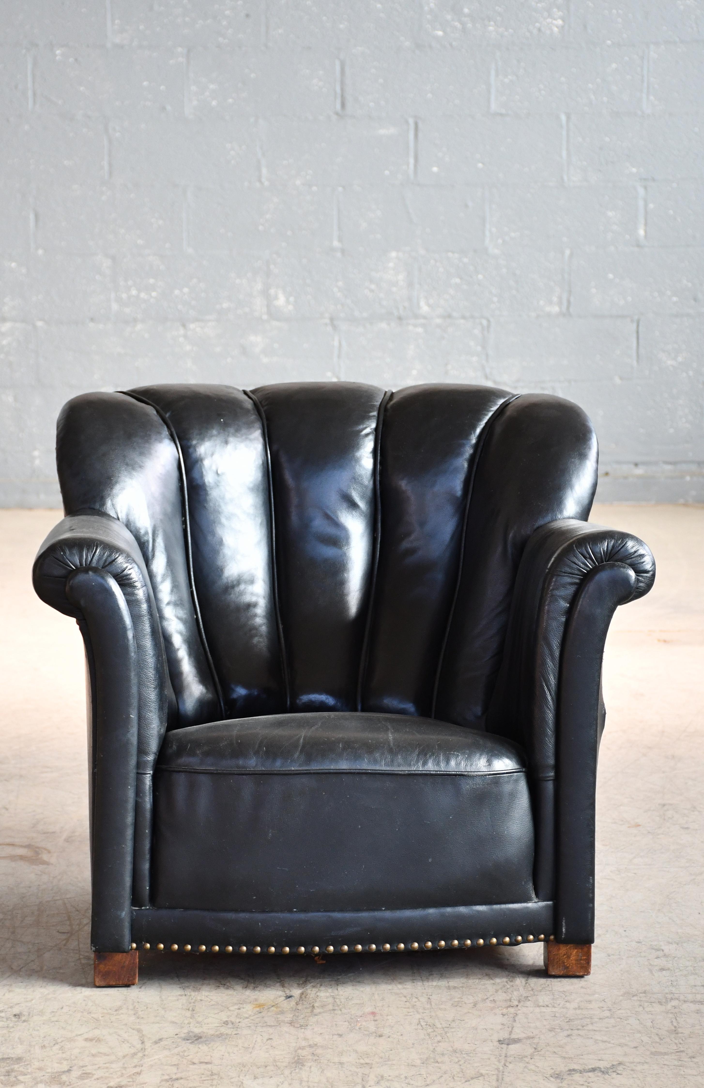 Large scale Danish club or lounge chair made in the late 1930s. The chair is very similar to Fritz Hansen's model 1518 with a little bit more upright front.  It is not unlikely that this could be an earlier version of the classic model 1518 which