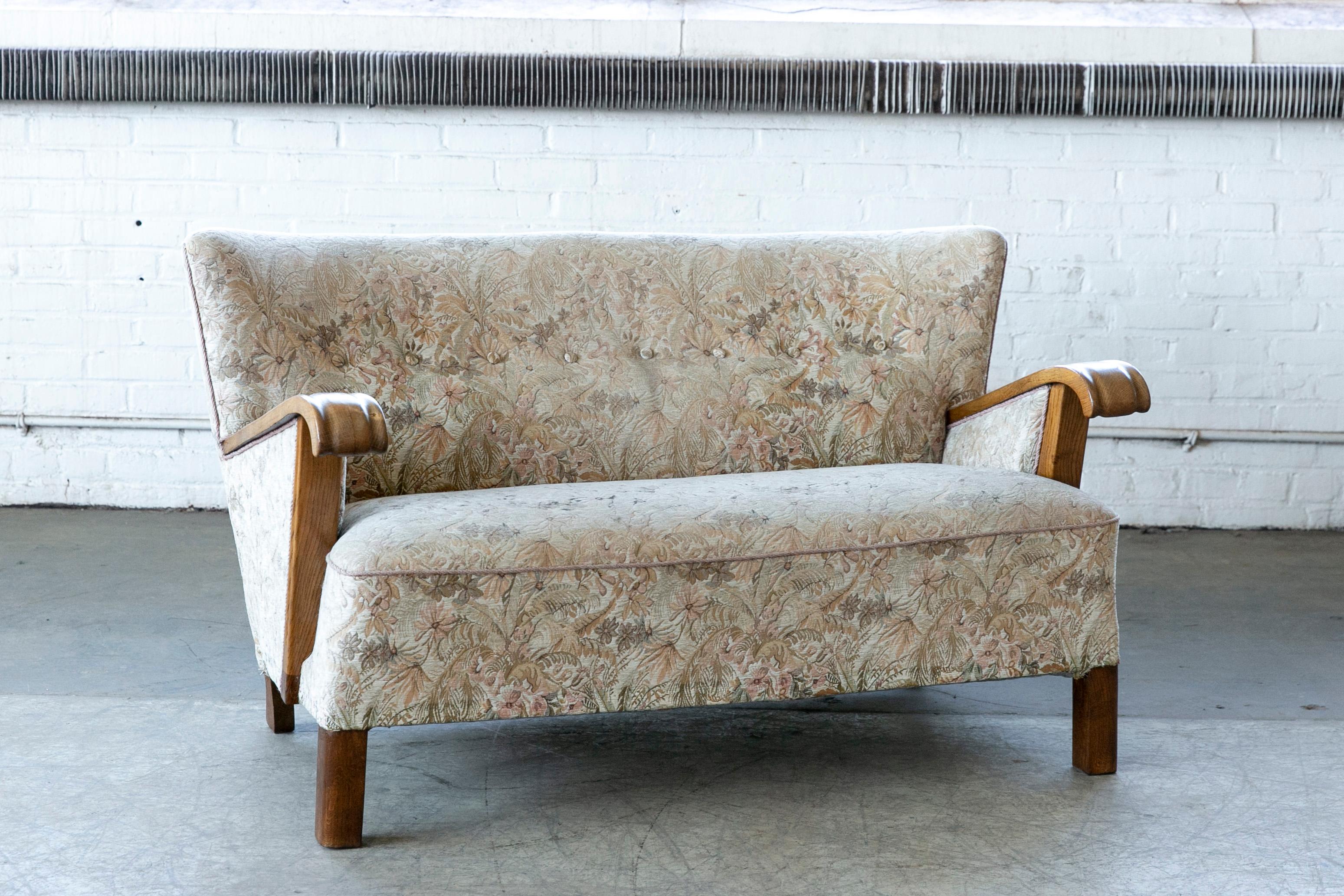 Elegant and charming easy style from the 1940s very typical of Fritz Hansen's design style both in terms of legs and armrests leading many dealers in Denmark to believe the sofa is indeed by Fritz Hansen. But nobody knows for sure. These type of
