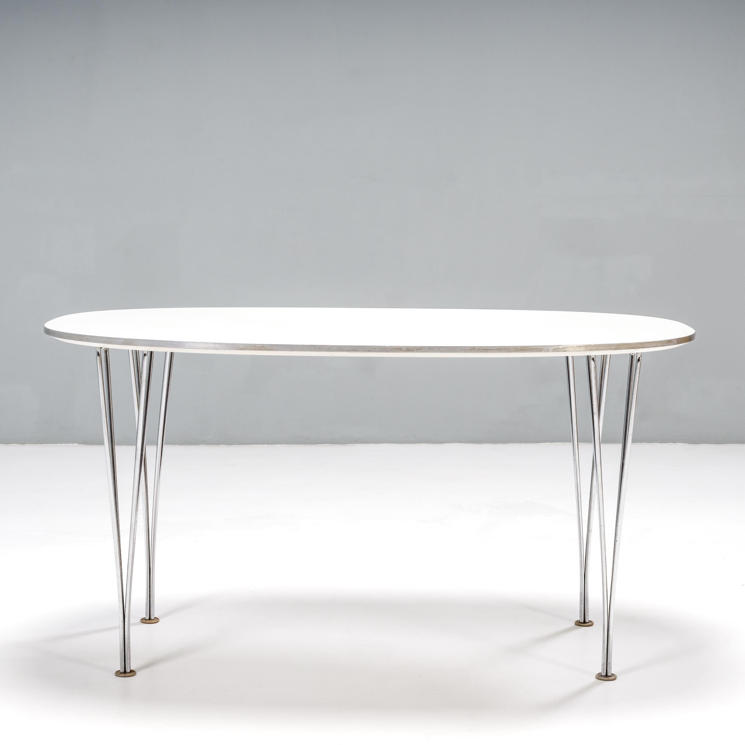 Originally designed by Piet Hein and Bruno Mathsson in 1966, this Super-Ellipitic table remains a contemporary piece of design.

Constructed with a white wood veneer top, the table sits on chromed steel legs and features rounded corners to create