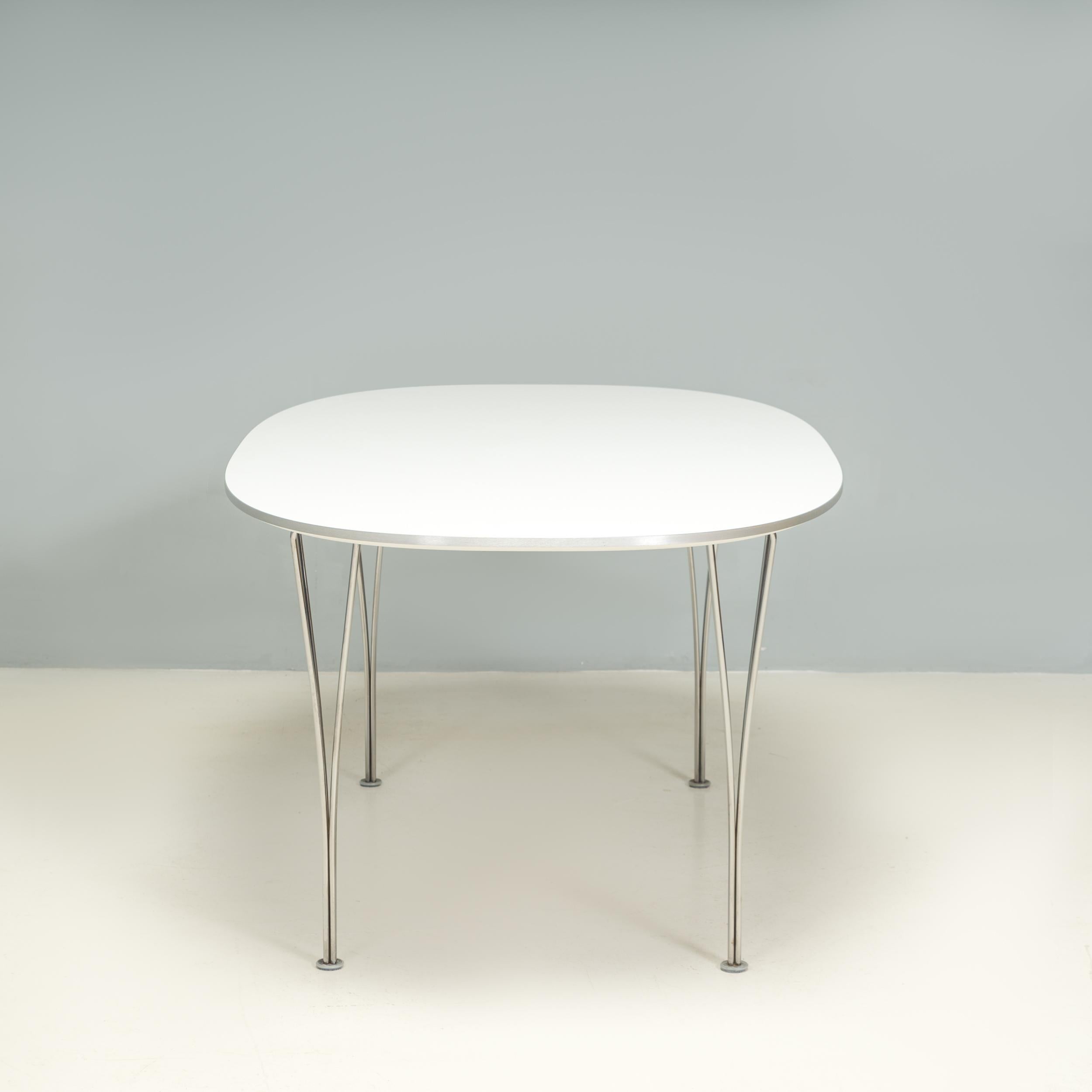Originally designed by Piet Hein and Bruno Mathsson in 1966, this Super-Ellipse table remains a contemporary piece of design.

Constructed with a white wood veneer top, the table sits on chromed steel legs and features rounded corners to create the