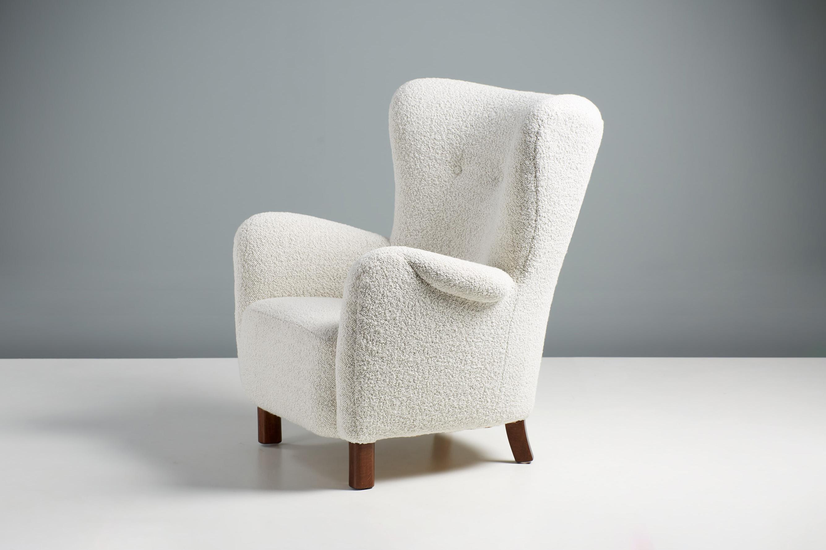 Peter Hvidt Armchair for Fritz Hansen Denmark, circa 1940s.

A wing-back armchair produced by Fritz Hansen in Denmark circa 1940s and designed by Danish icon: Peter Hvidt. The chair has been reupholstered in exquisite wool bouclé fabric from Dedar