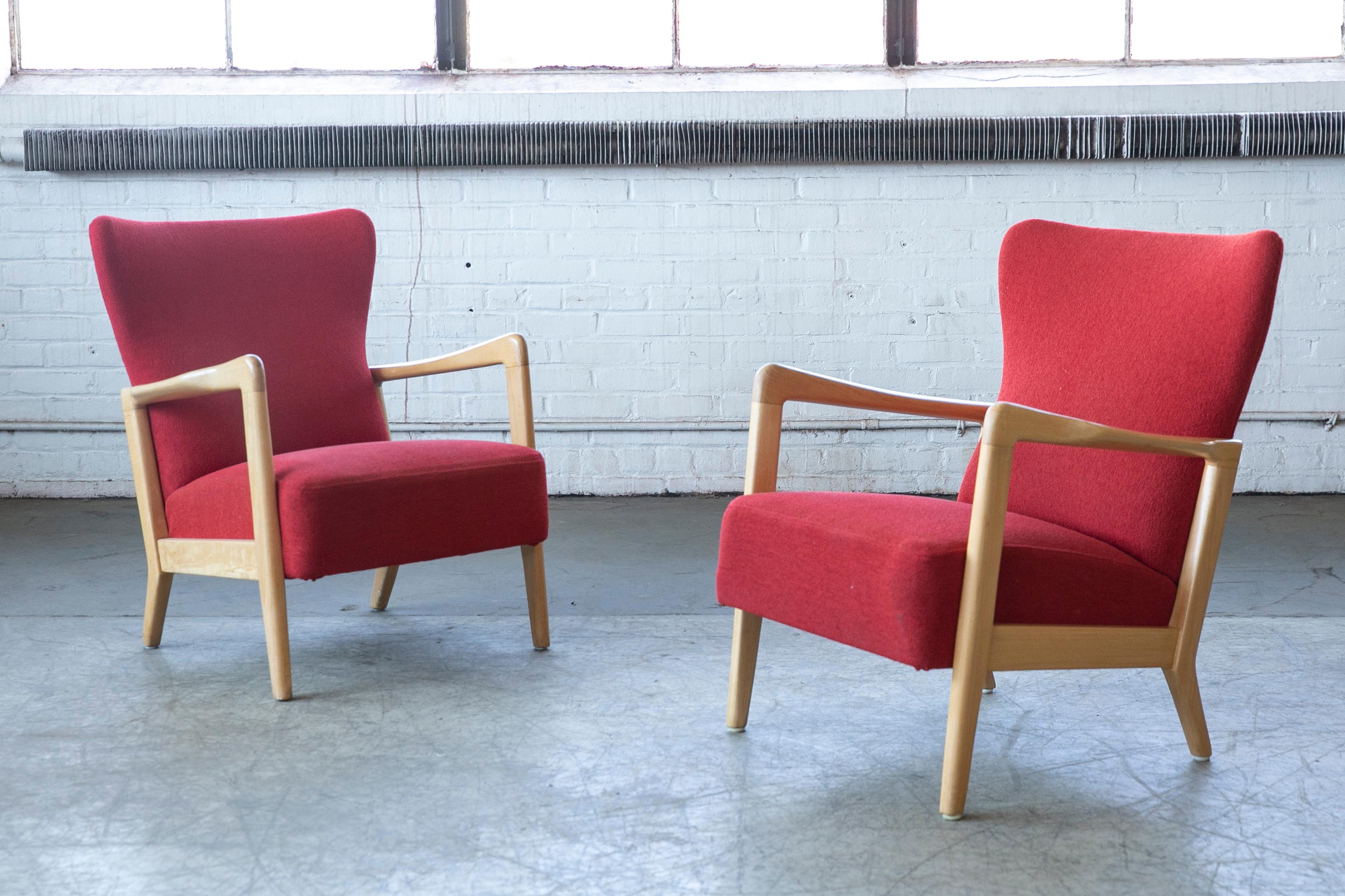 Very stylish open armchairs designed by Soren Hansen for Fritz Hansen in the early 1940s but judging from the wood color probably manufactured in the early 1960's. This model was mainly made with high backs this set is has lower backrests adding a