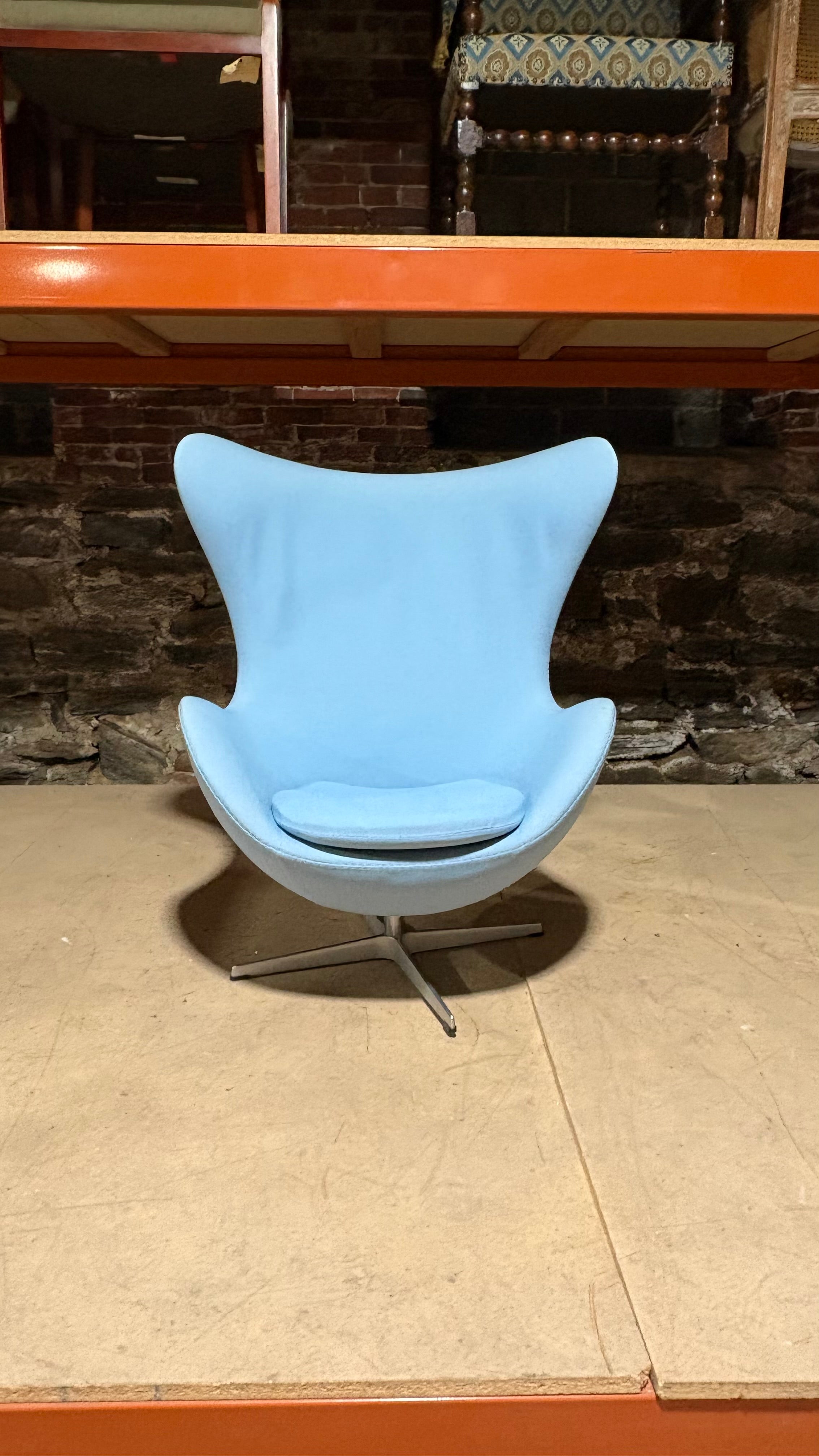 Authentic Fritz Hansen chair in eggshell . 

Designed by Arne Jacobsen

This chair measures 42 inches tall by 34 inches wide and 31 inches deep. The seat height is 15 inches.

Very good condition with minor imperfections like wrinkles on the back of