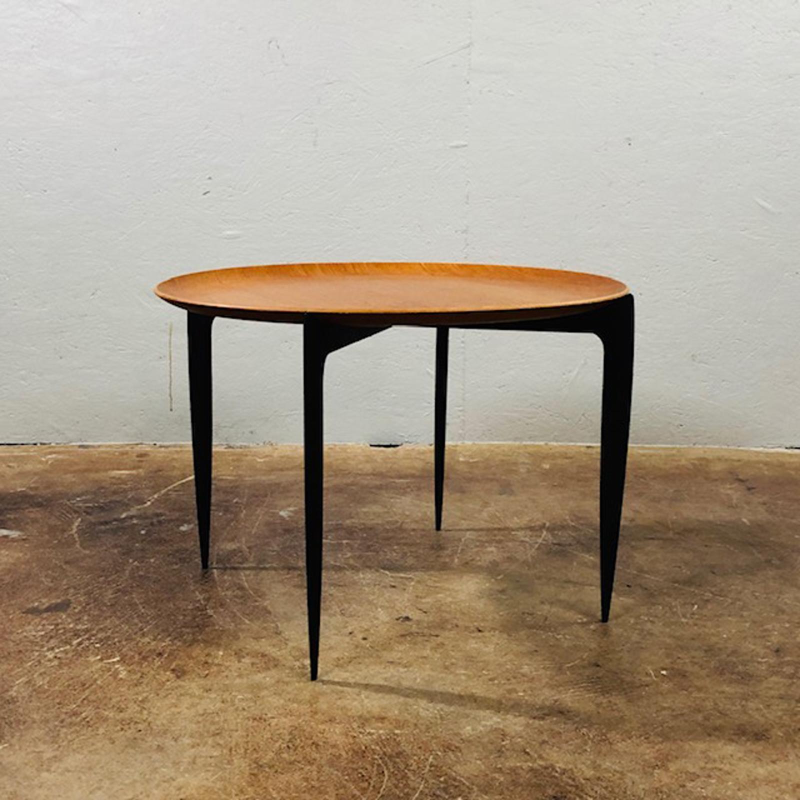 Fritz Hansen folding table designed in 1958 by H. Engholm and Svend A°ge Willumsen. Ebonized base folds for storage. The tray lifts off for serving and transport, circa 1960s.